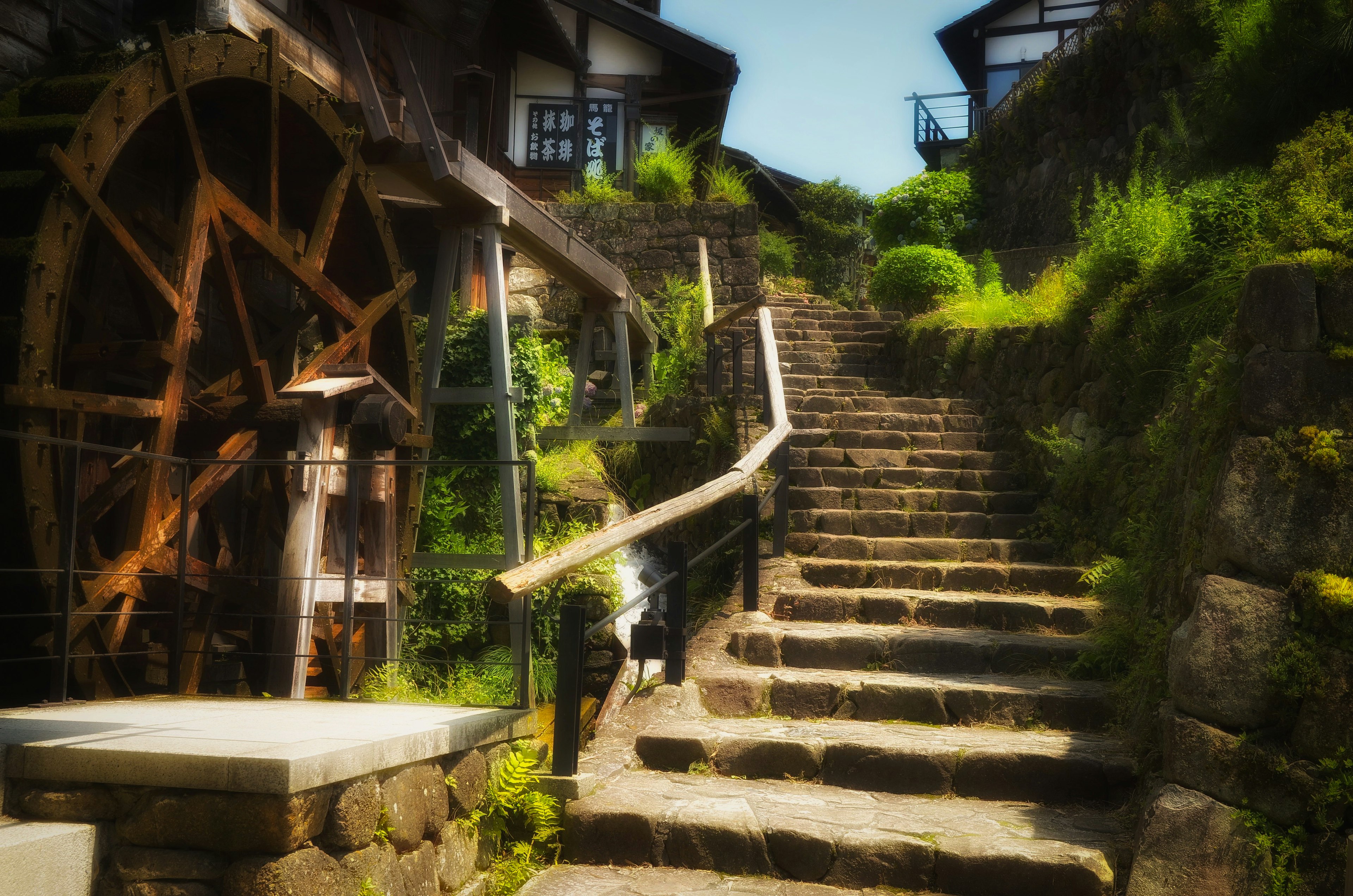 Scenic view of stone steps and a water wheel