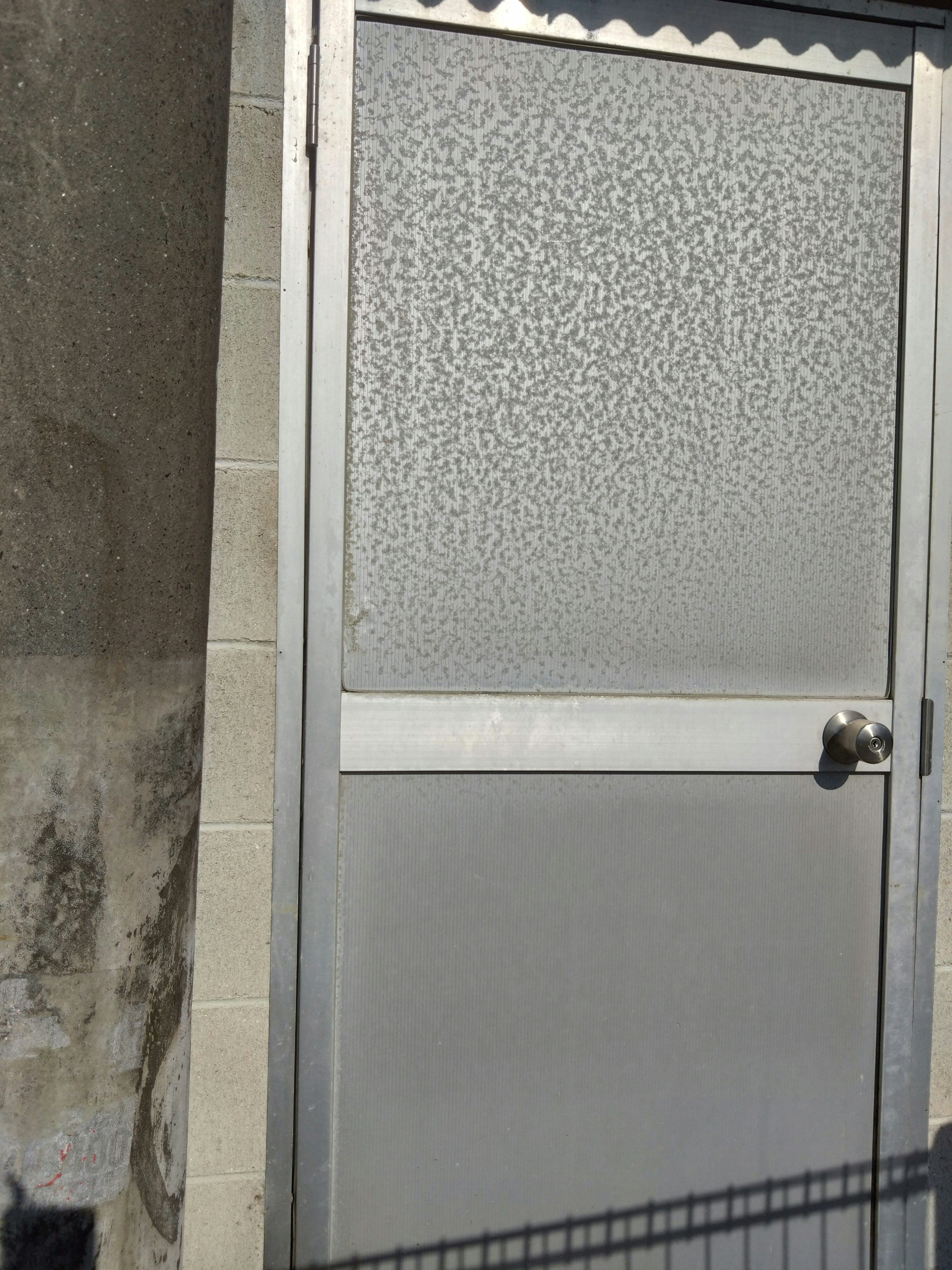 Frosted glass silver door with a metal handle