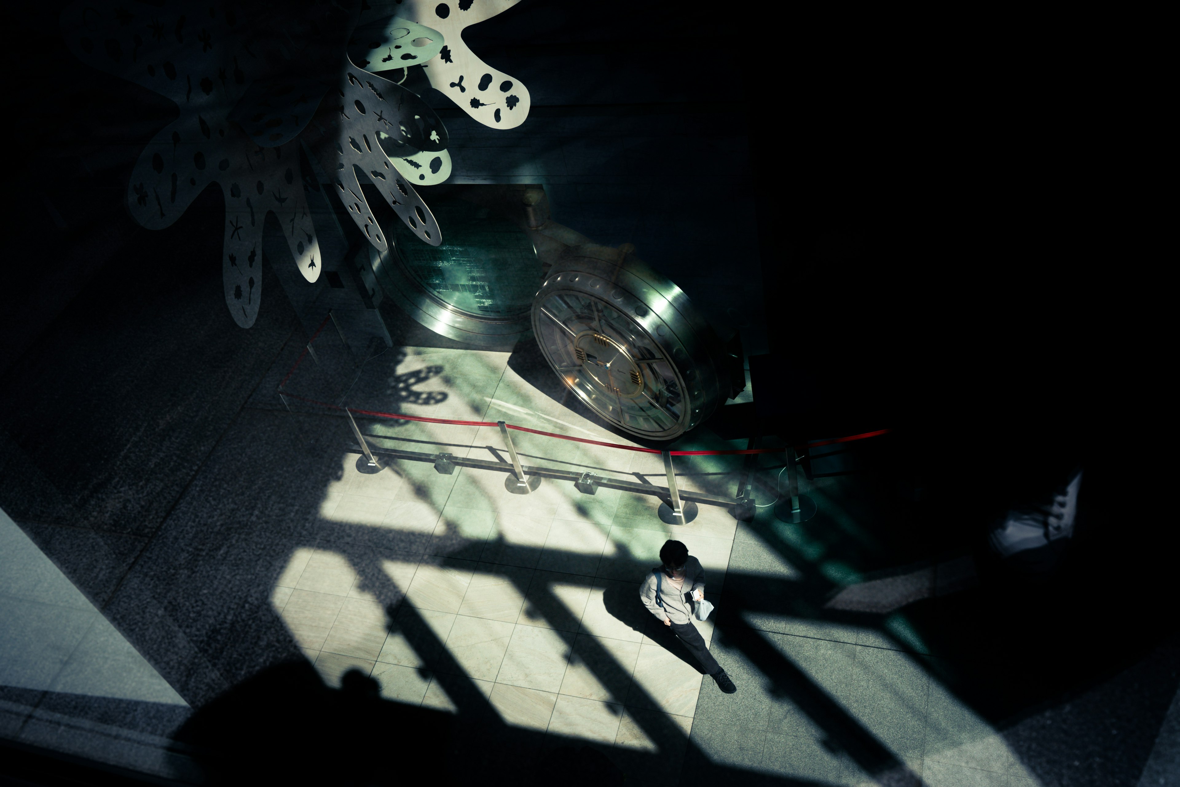 Scene featuring decorative objects and shadows in a dark room