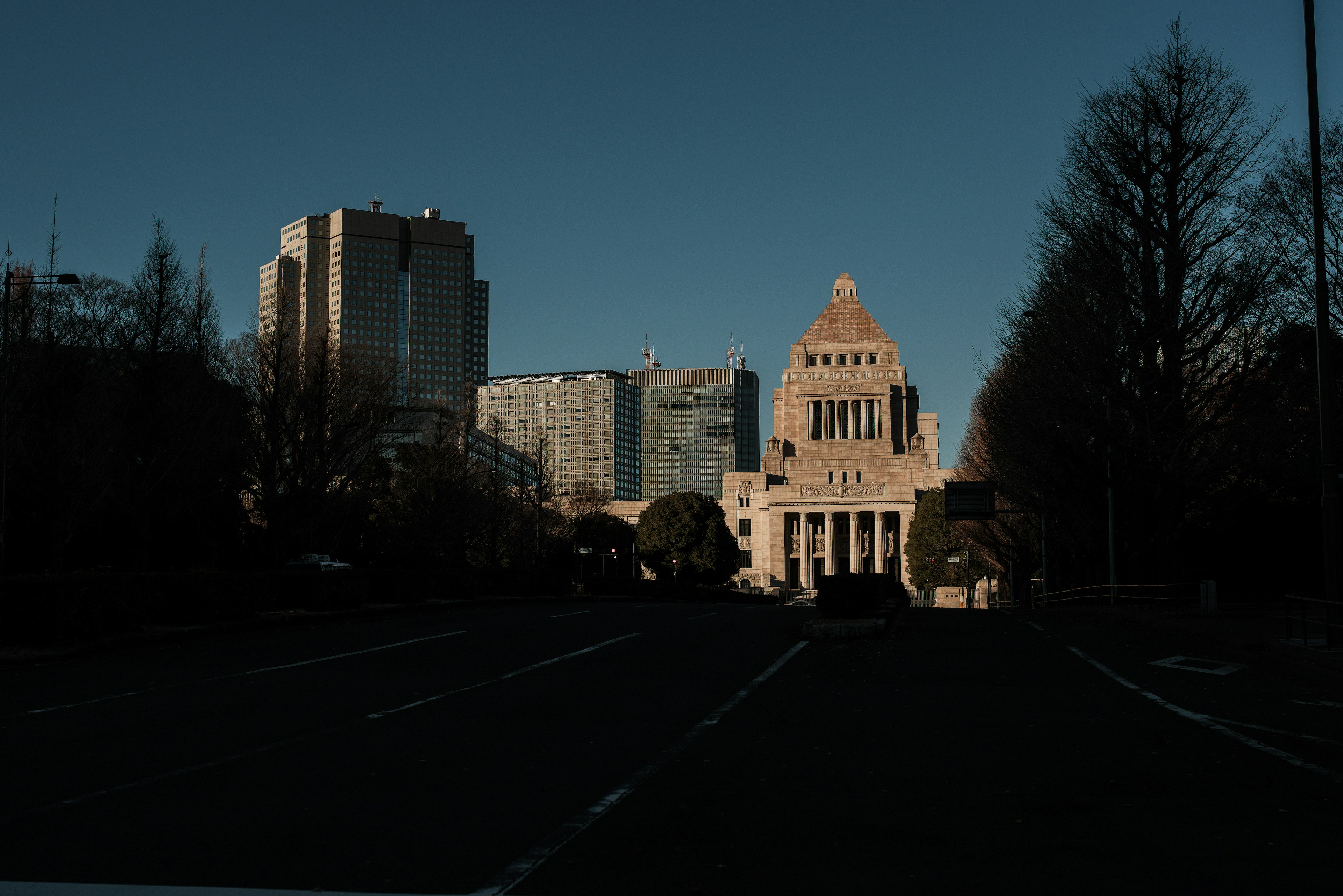 Silhouetted National Diet Building with skyscrapers in the background