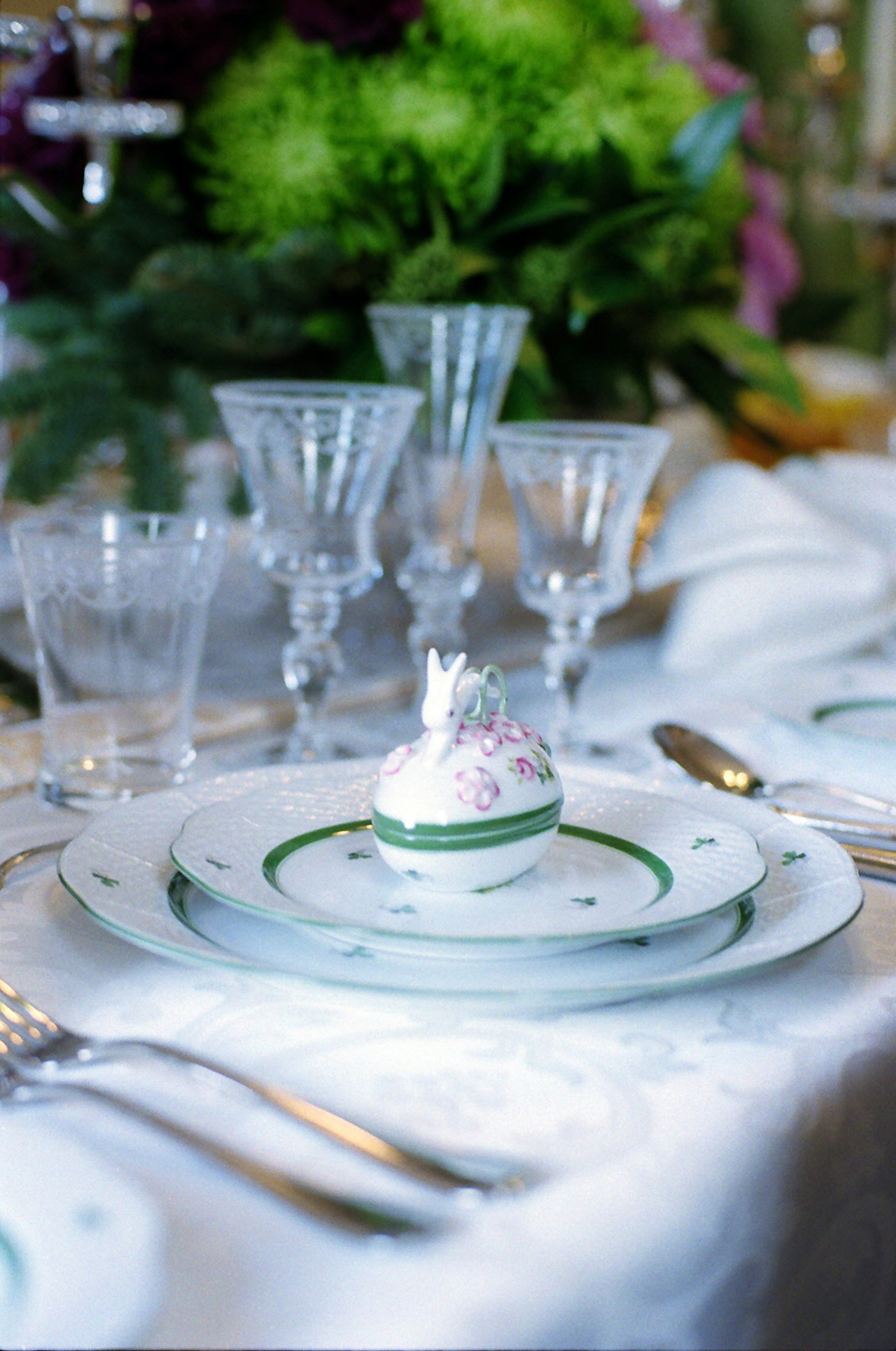 Elegant table setting featuring delicate dessert and floral background