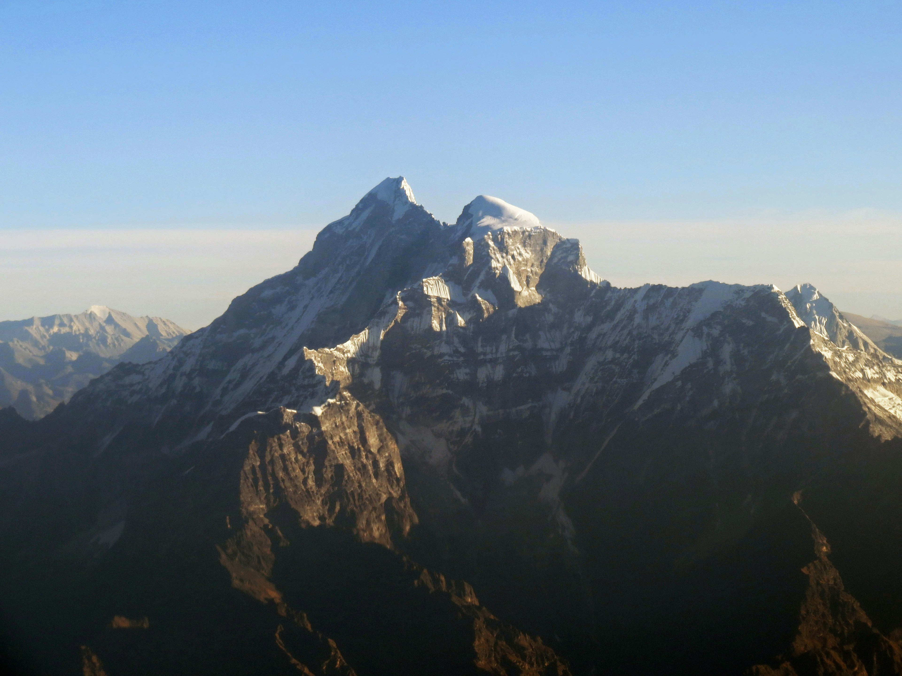 Majestic view of snow-capped mountains under a blue sky