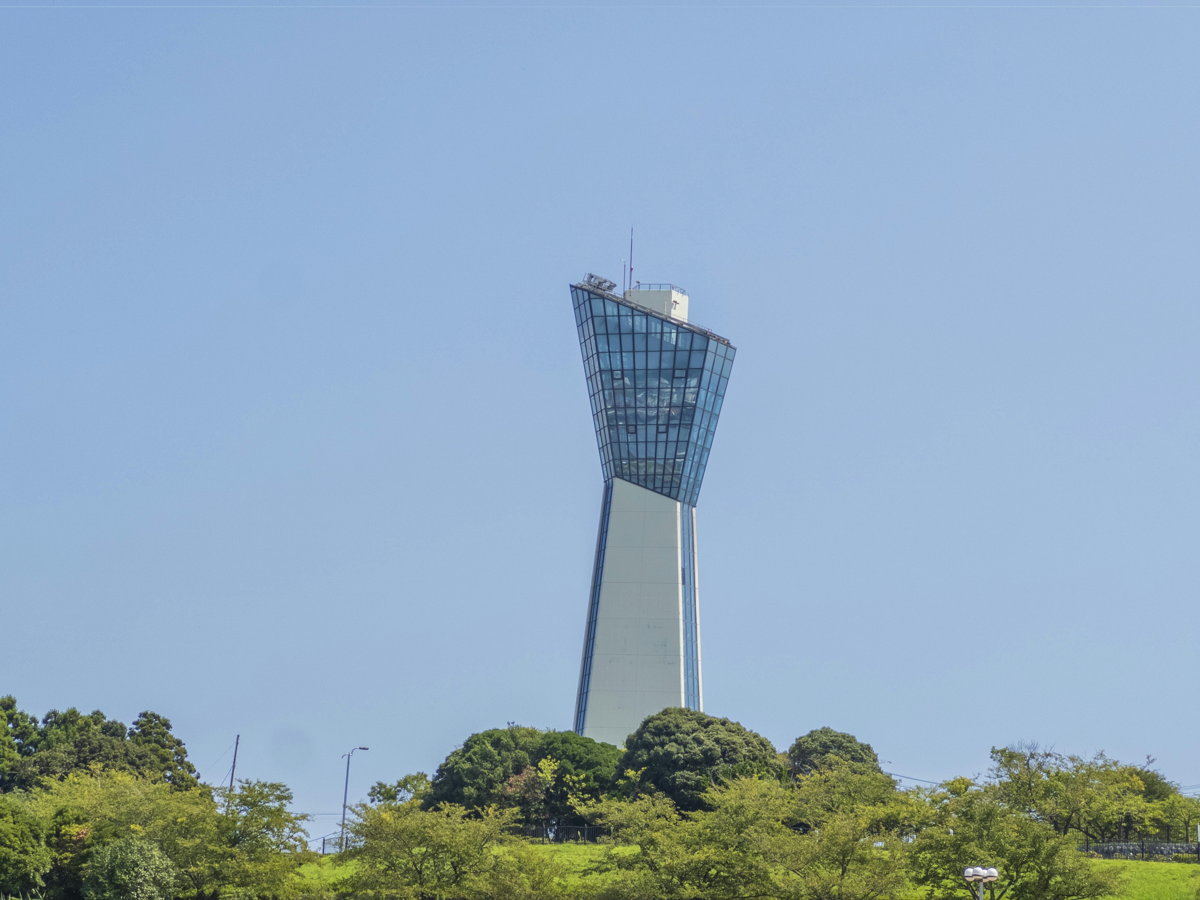 Modern tower standing under a clear blue sky