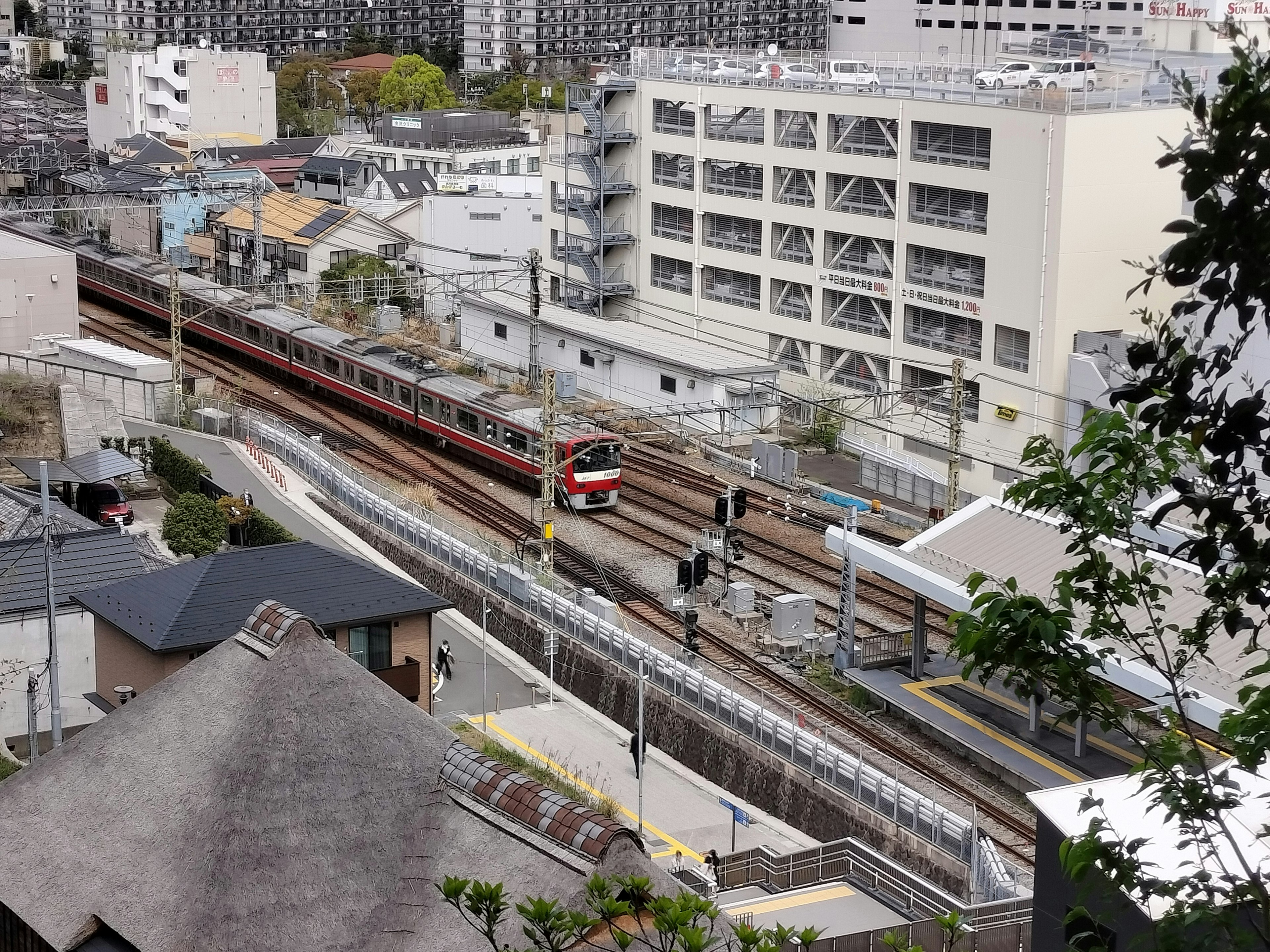 Aerial view of a train station with surrounding buildings