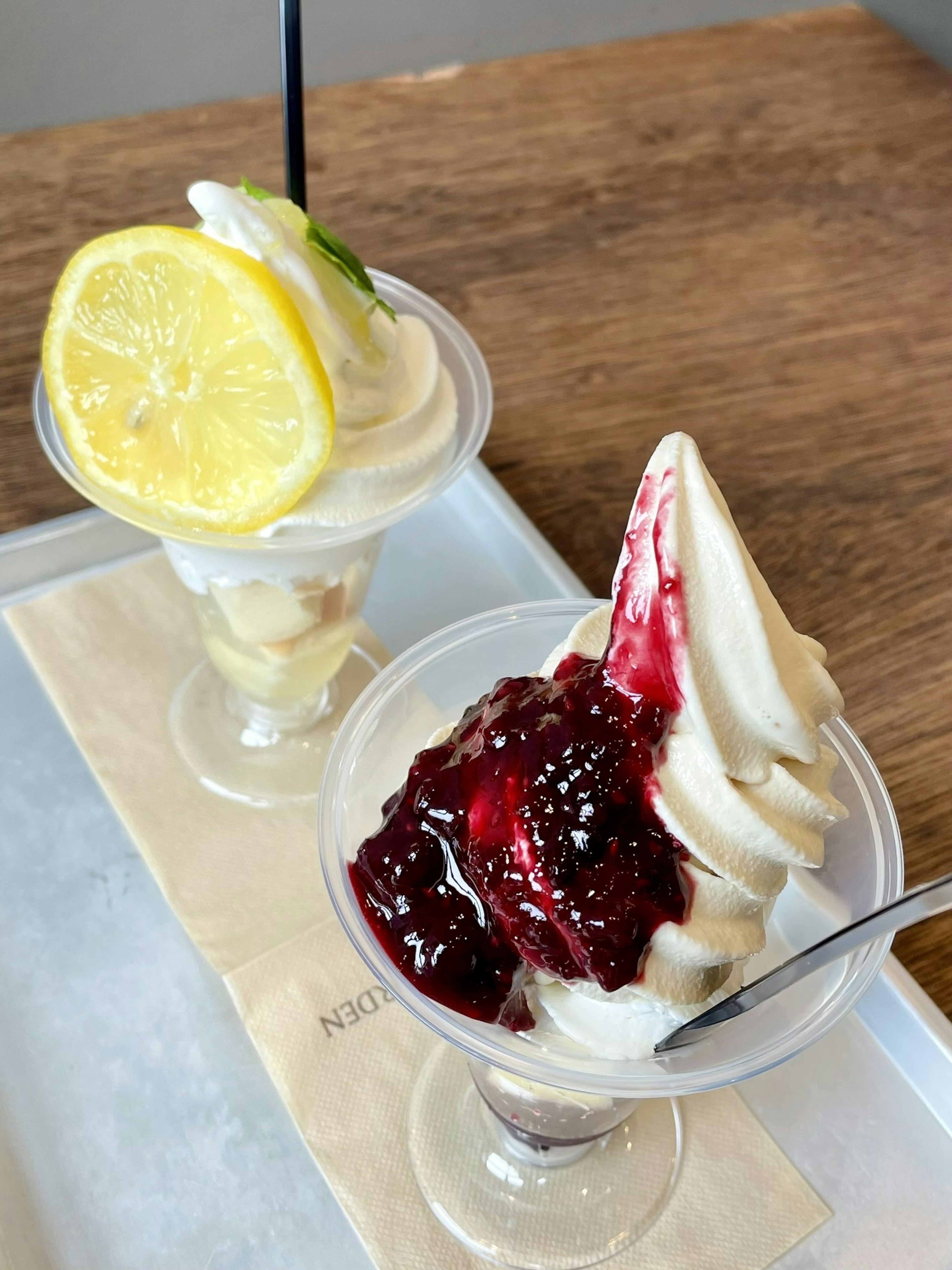 Desserts featuring lemon soft serve and berry sauce soft serve