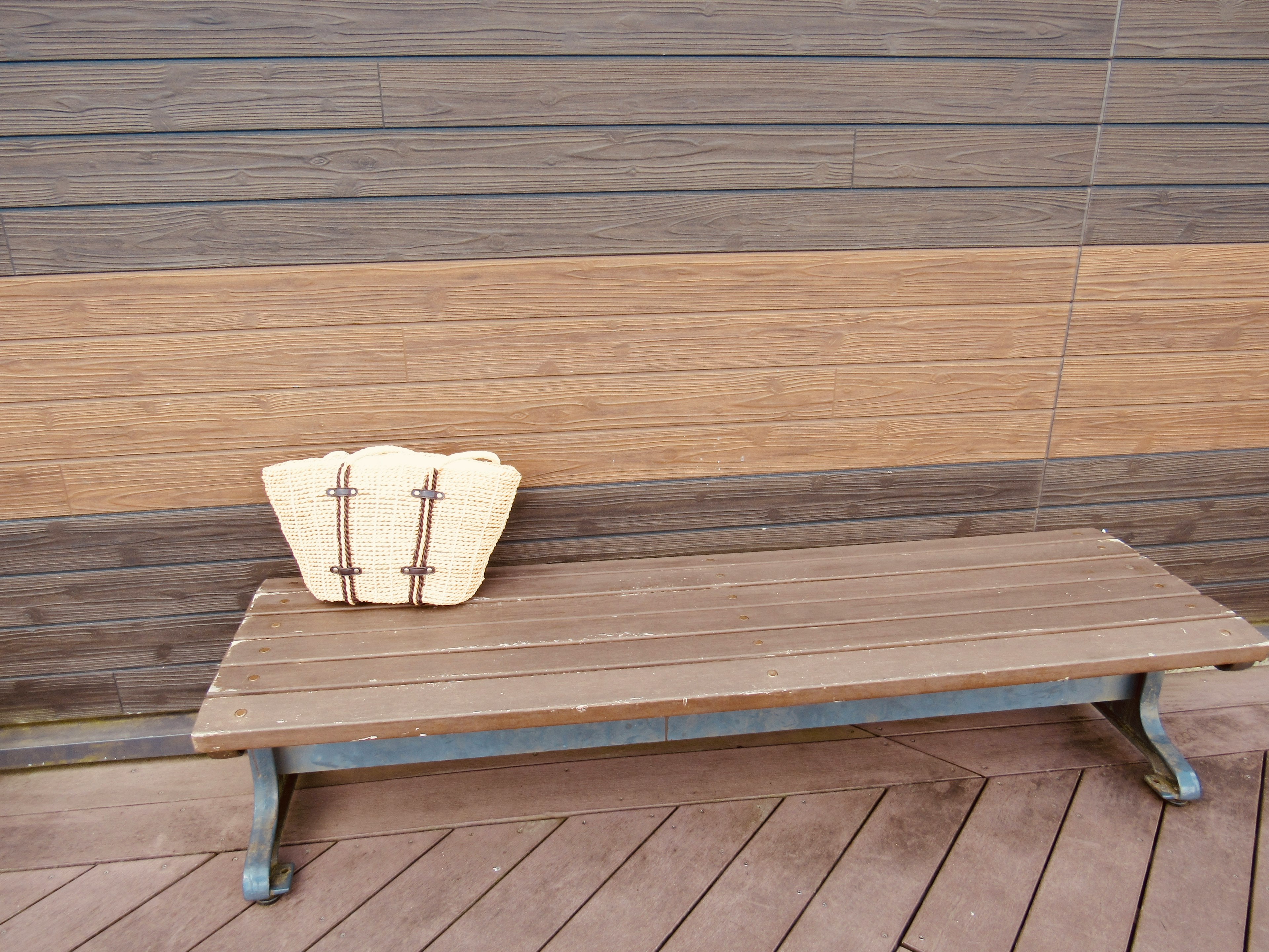 Simple design featuring a wooden bench against a wooden wall