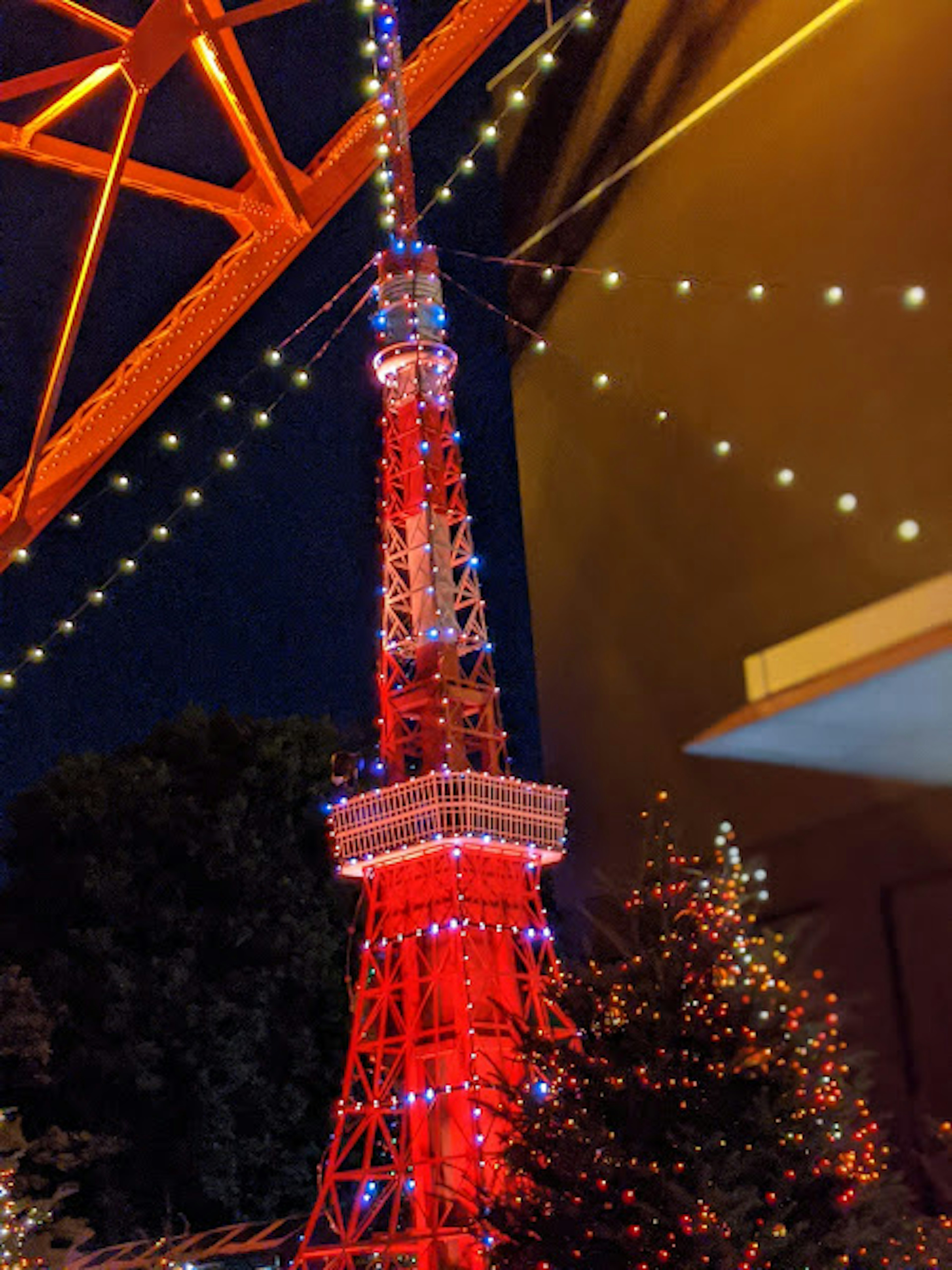 Tokyo Tower illuminated at night with festive lights