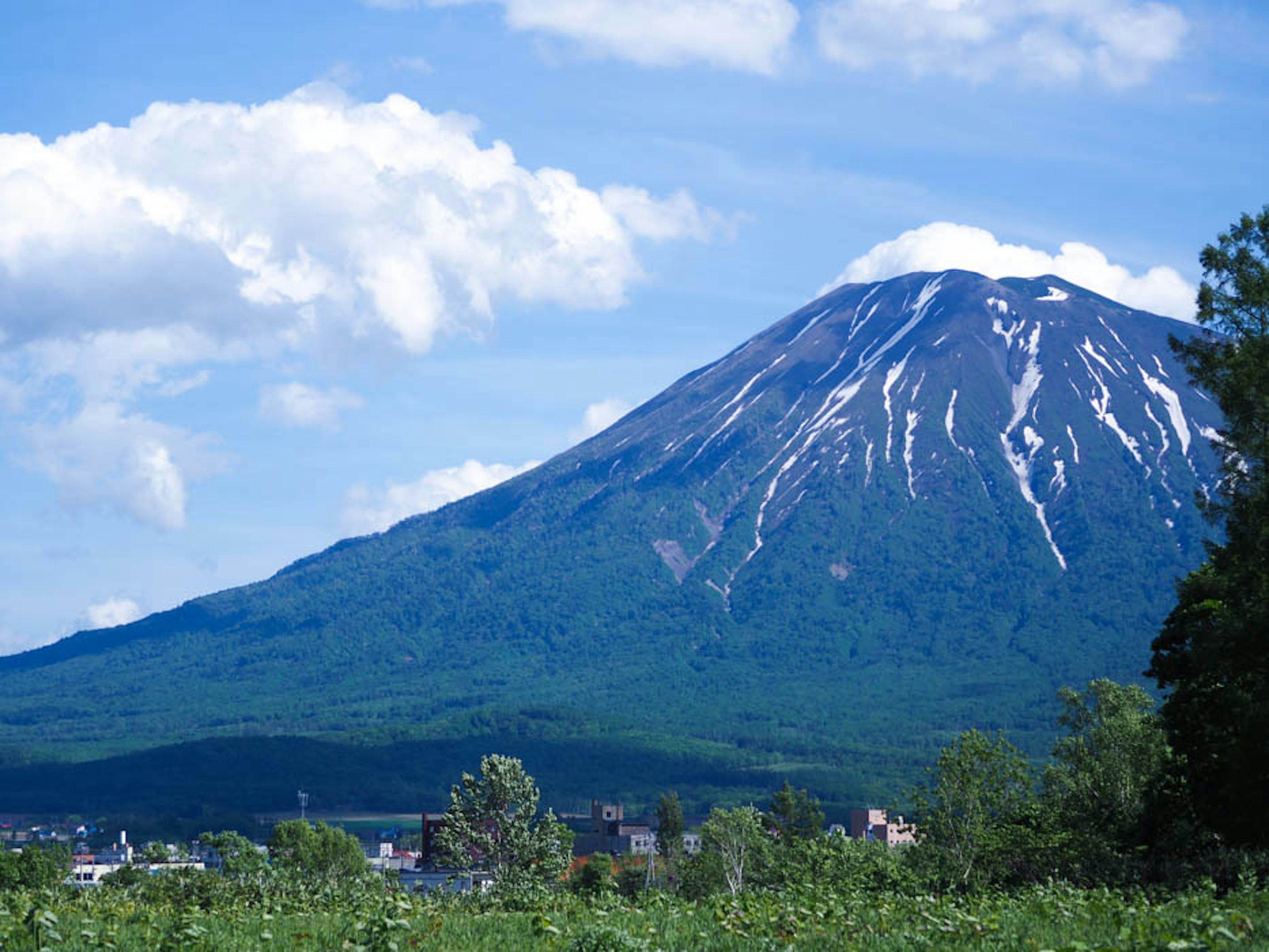 Snow-capped mountain under a beautiful blue sky