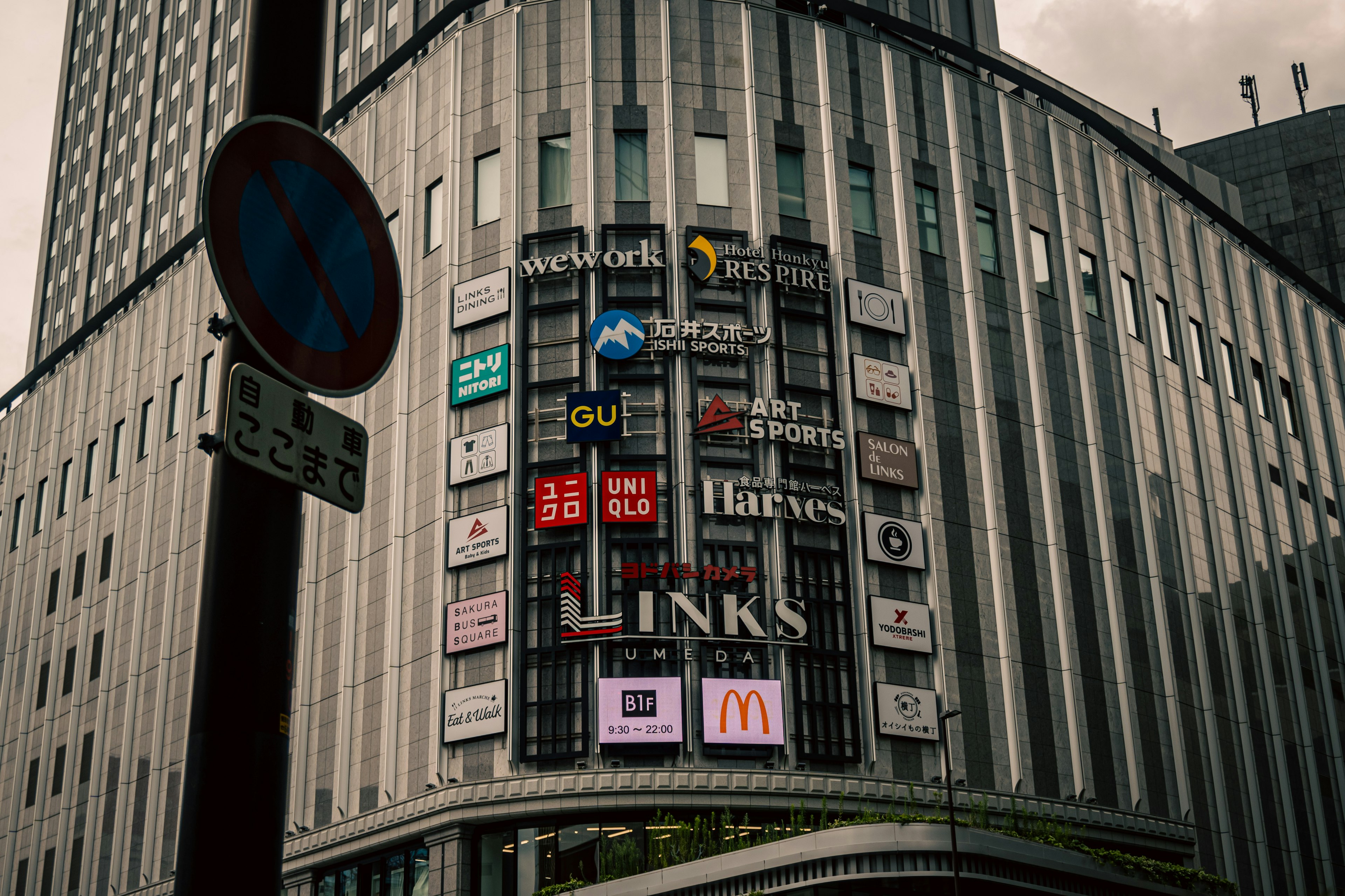 Modern building facade featuring various signage