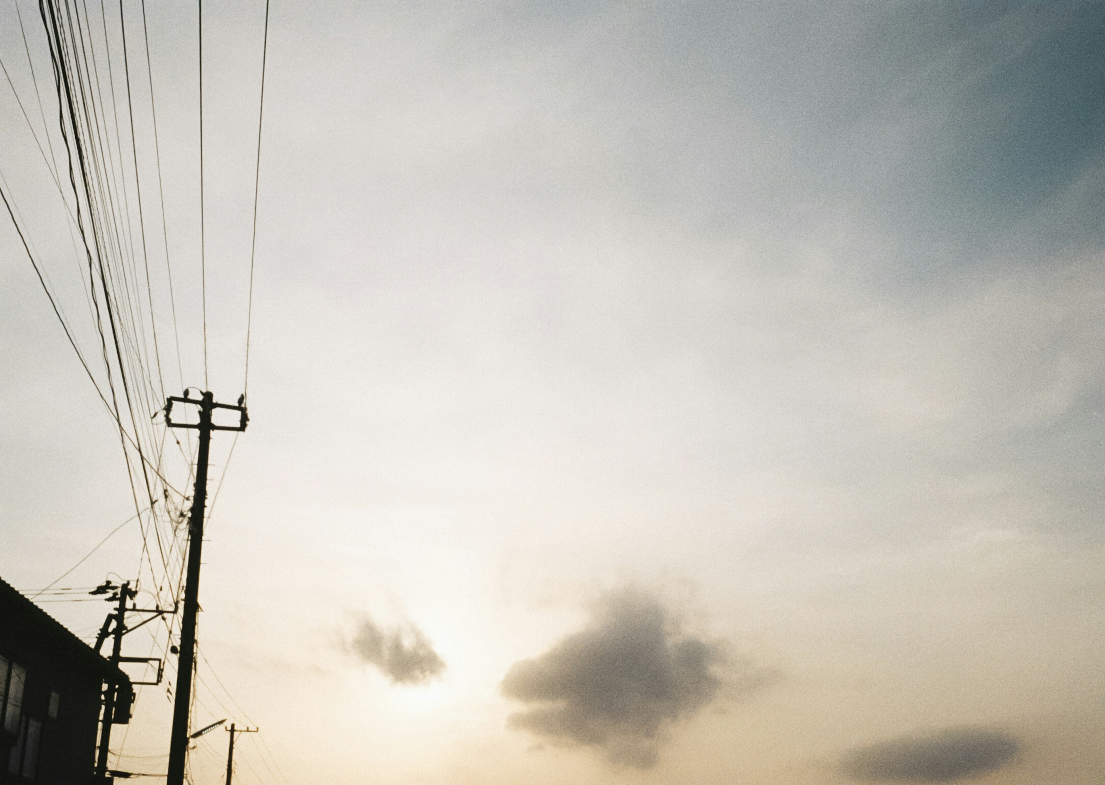 Quiet evening sky with silhouettes of utility poles