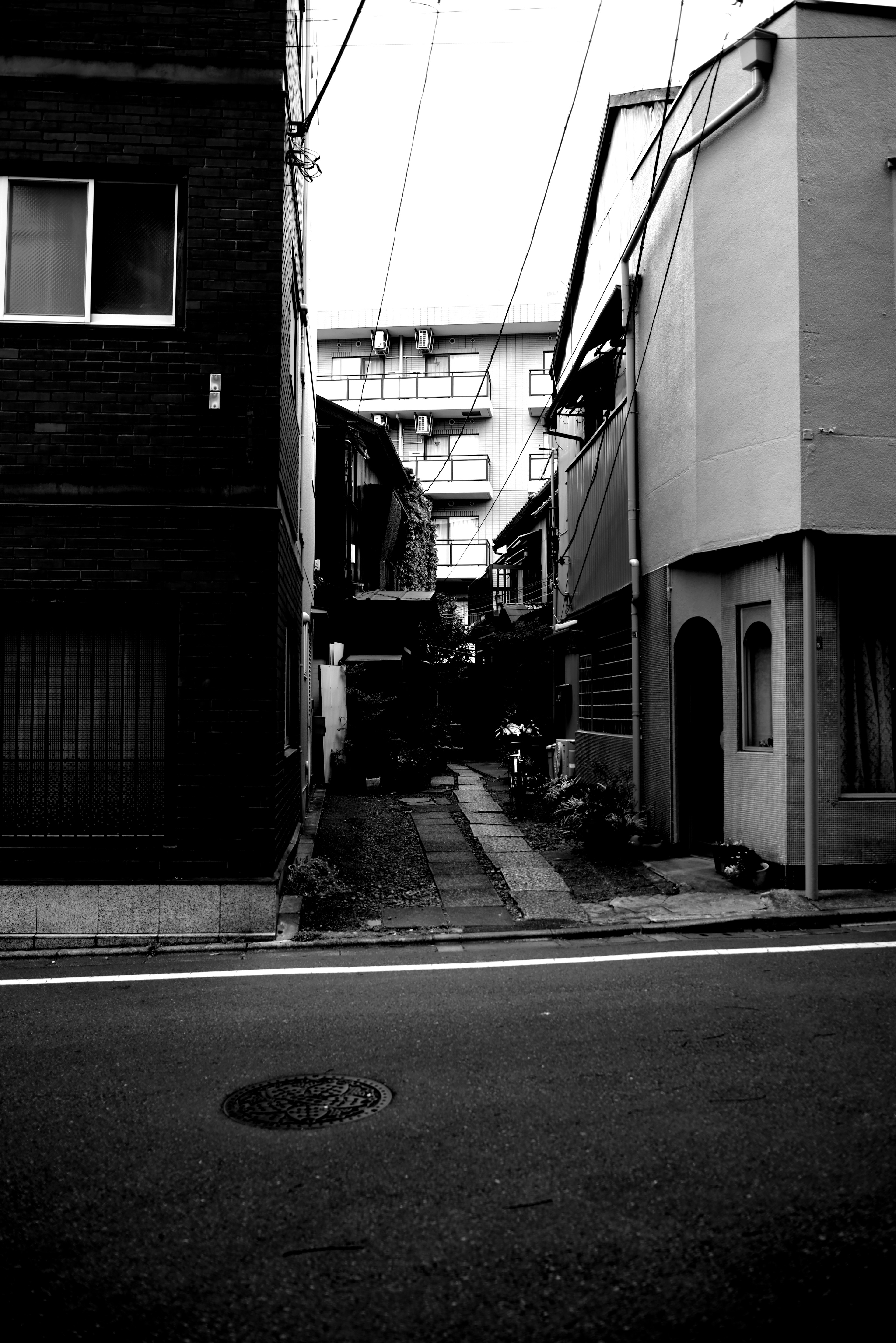 Contrast of old and new buildings on a narrow street