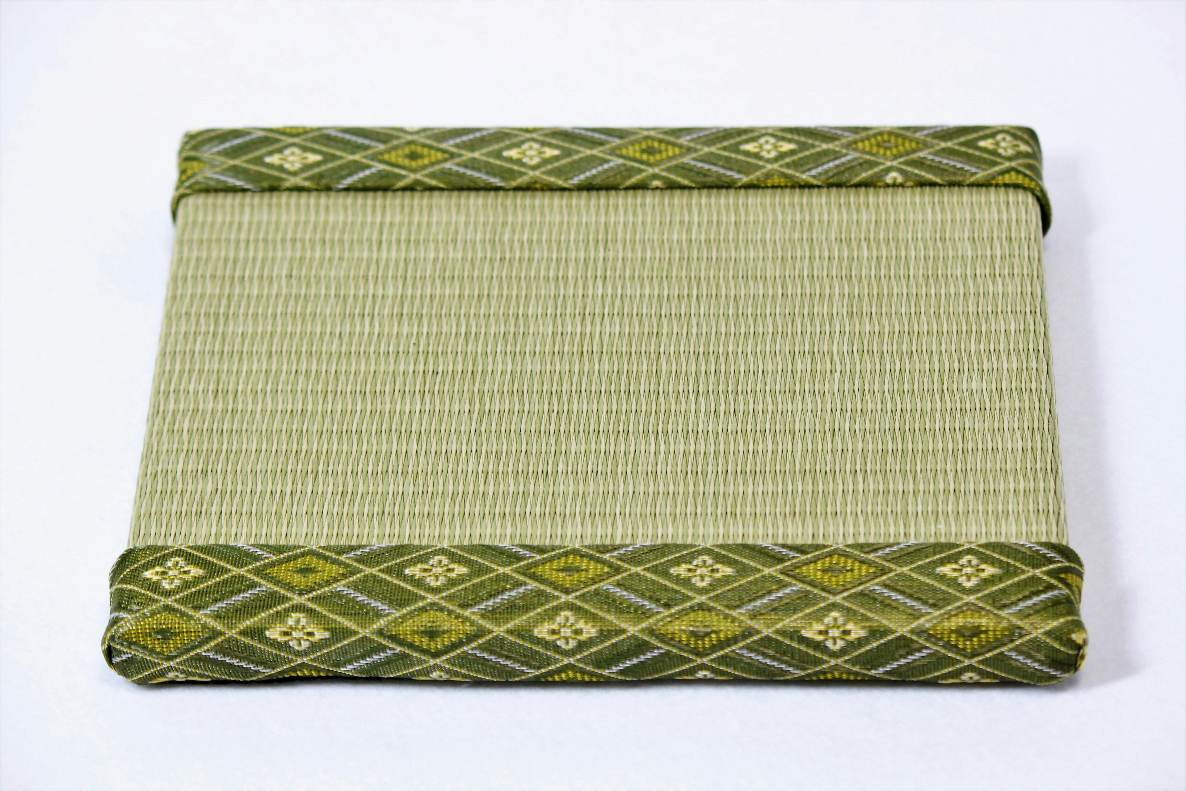 Japanese-style mat with green decorative borders