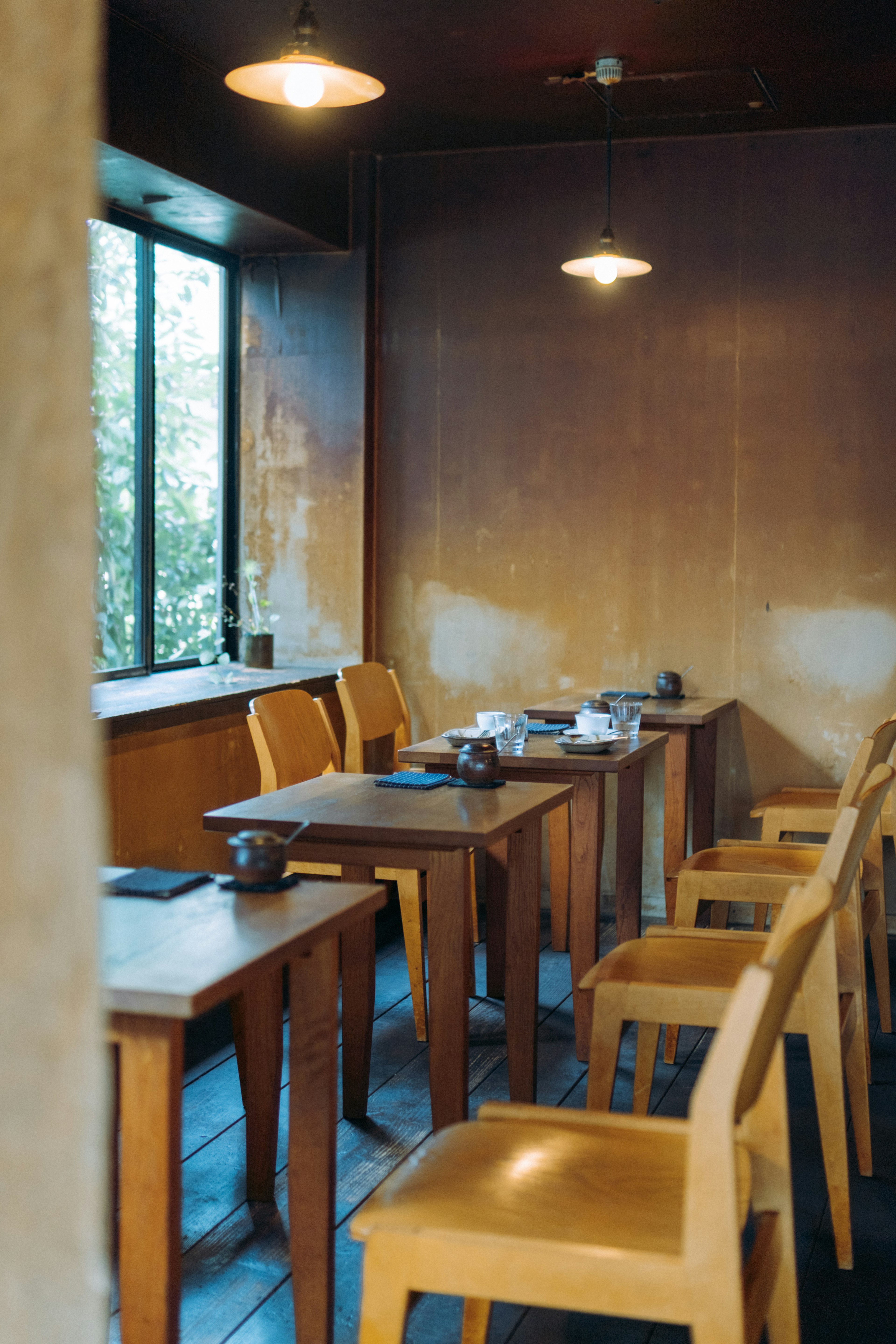 Interior of a cafe with wooden tables and chairs