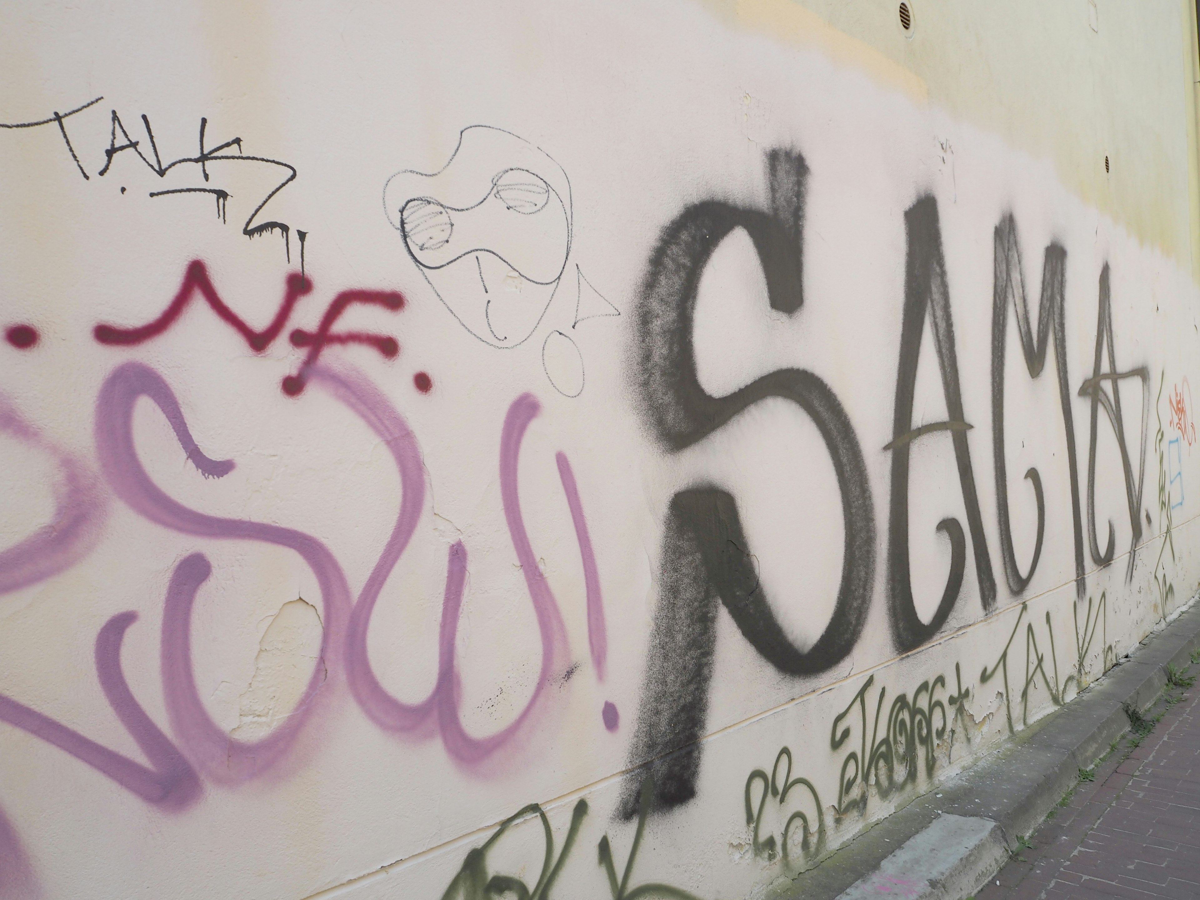 Graffiti art on a wall featuring the word SAMA prominently displayed