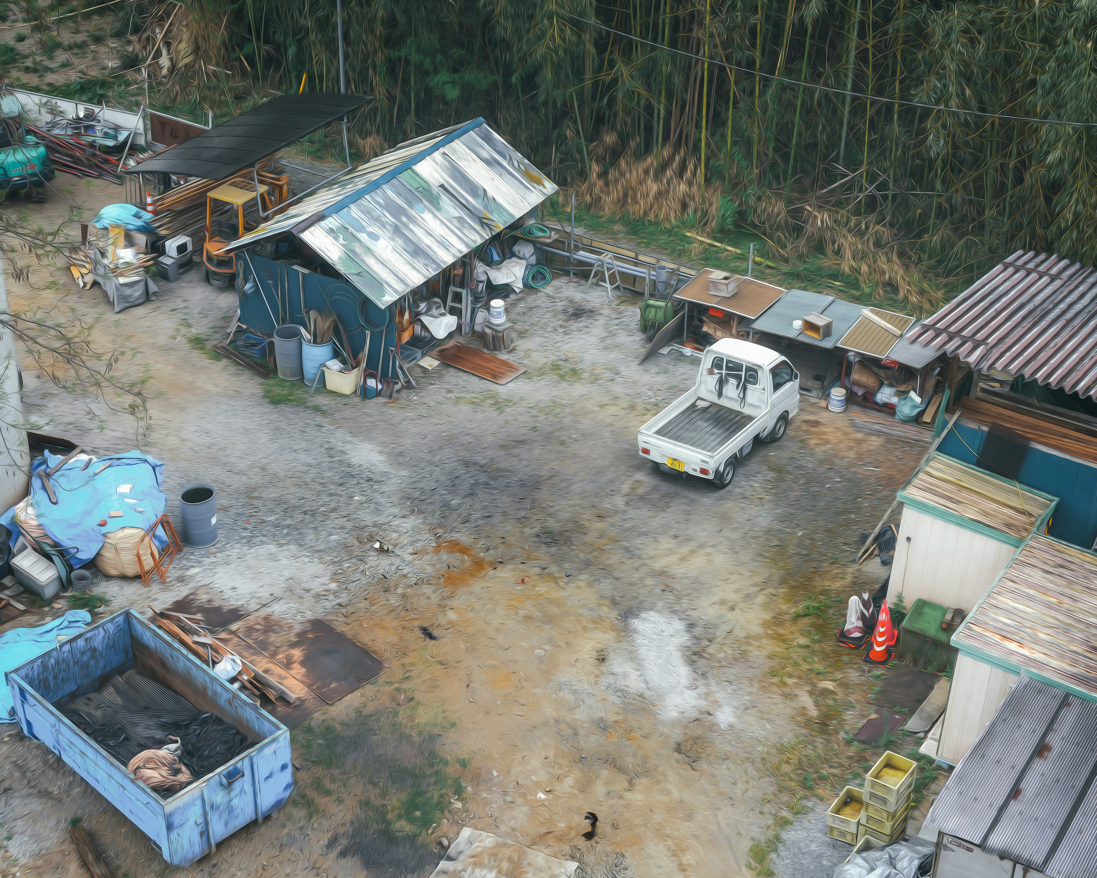 Aerial view of a construction site featuring old warehouses and a truck