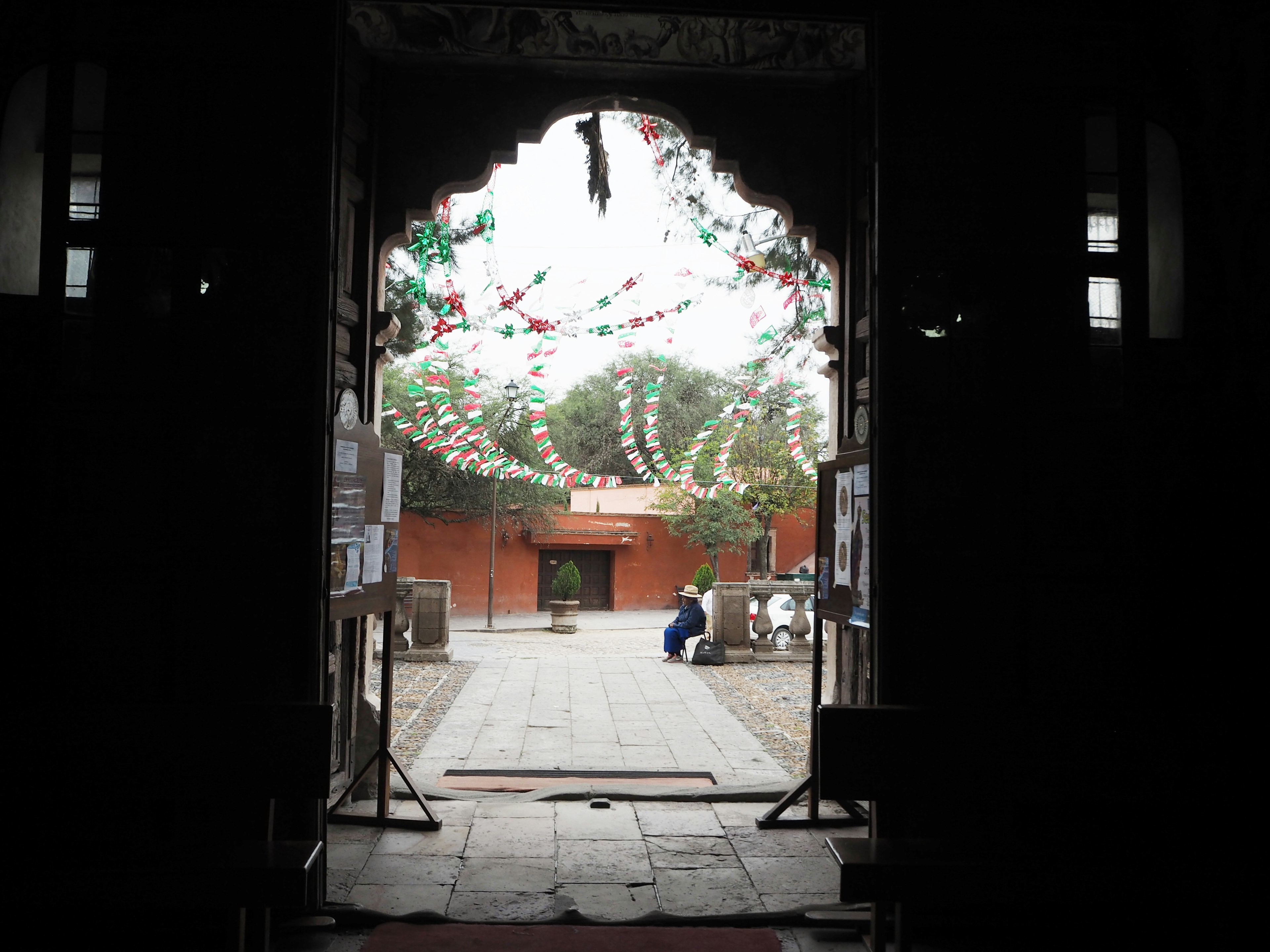 View of a decorated courtyard through an archway