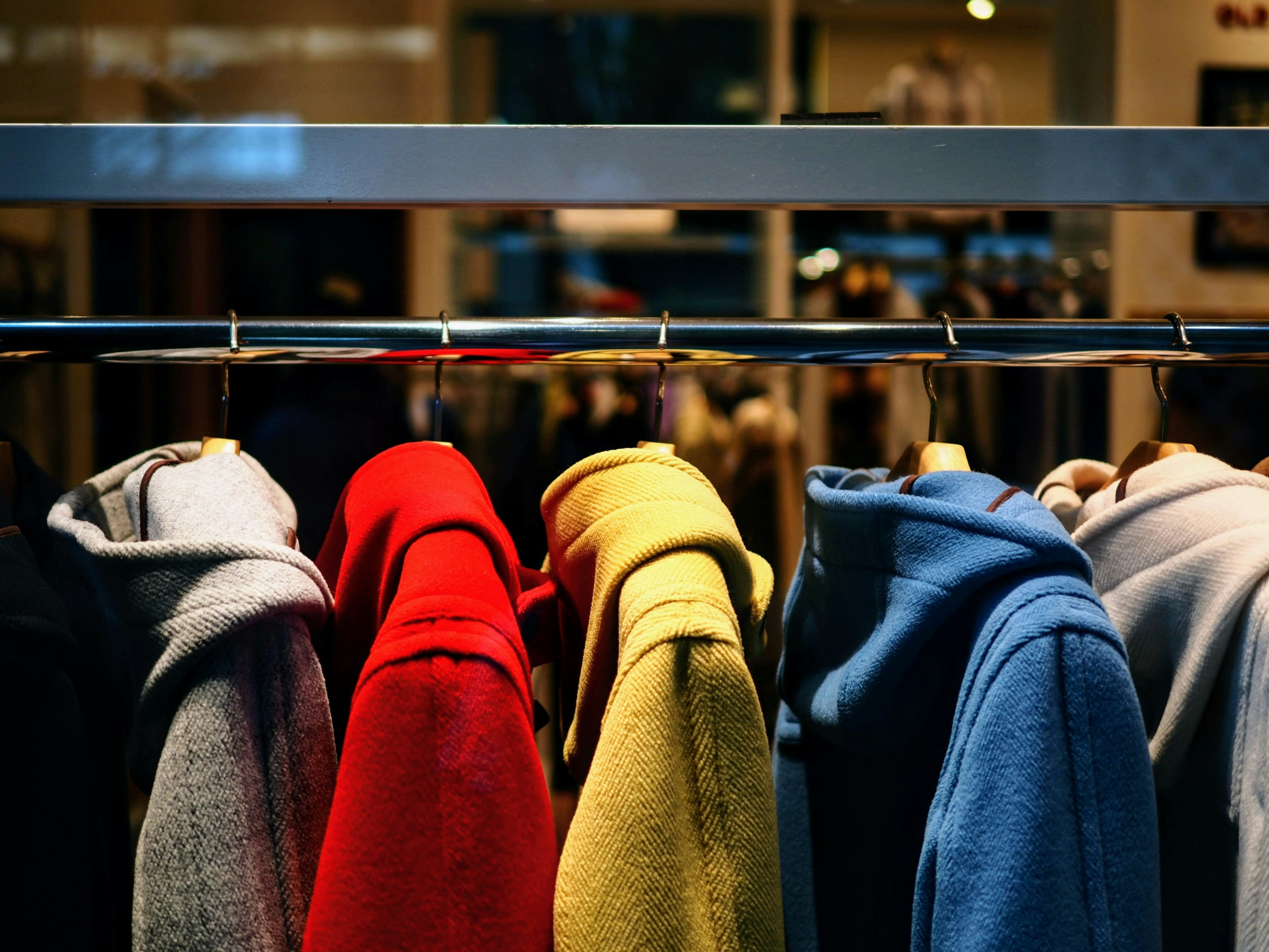 Colorful coats hanging on a clothing rack