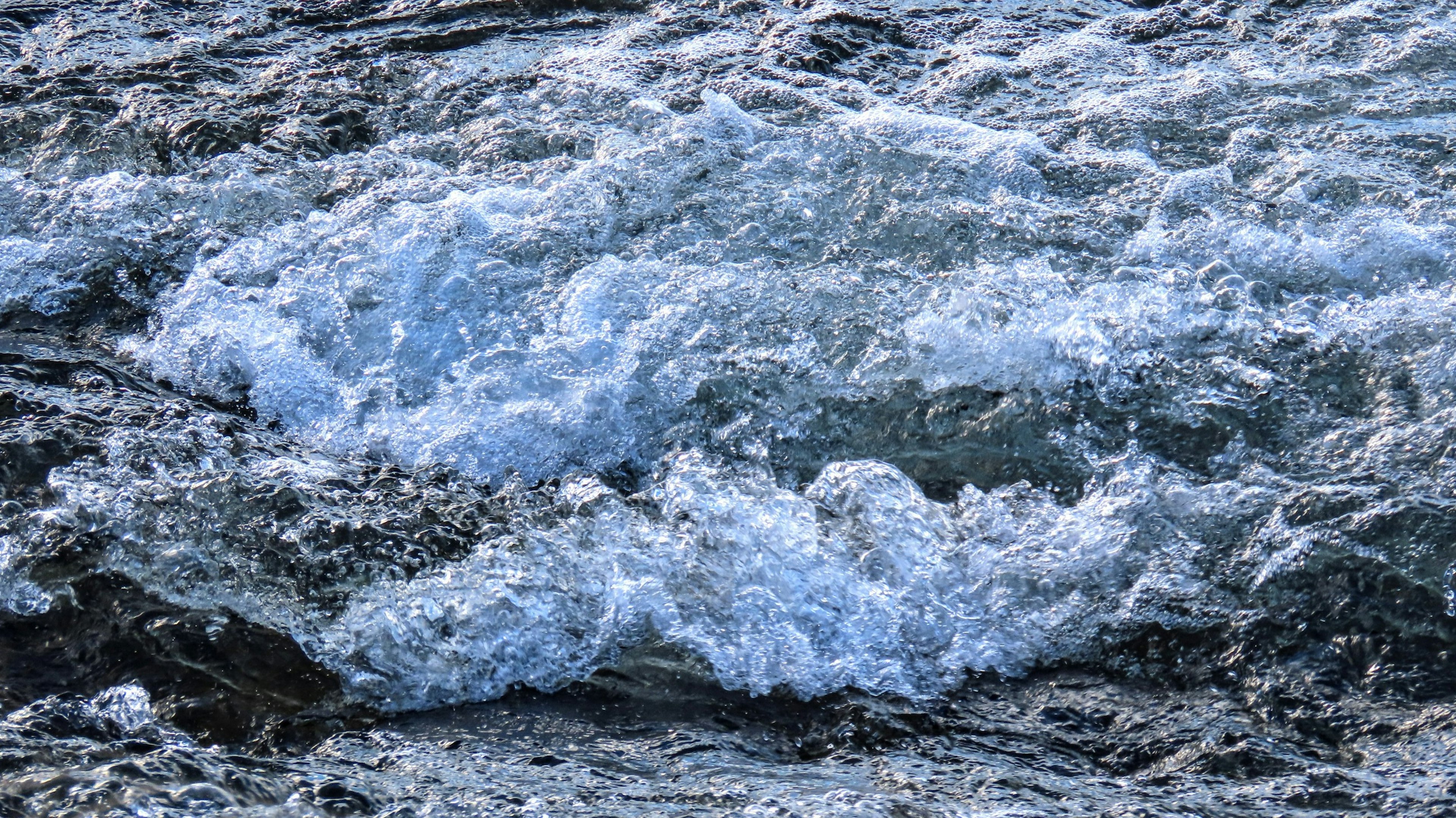 The motion of waves crashing on water