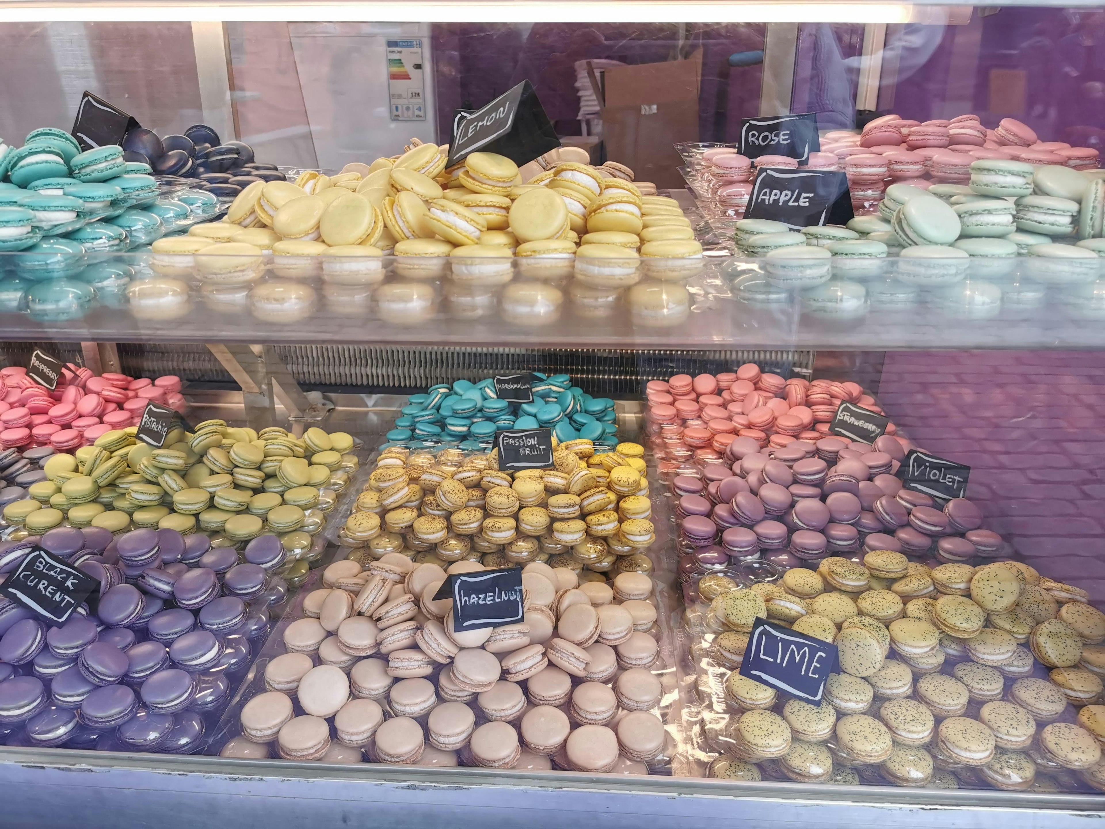 Colorful macarons displayed in a showcase