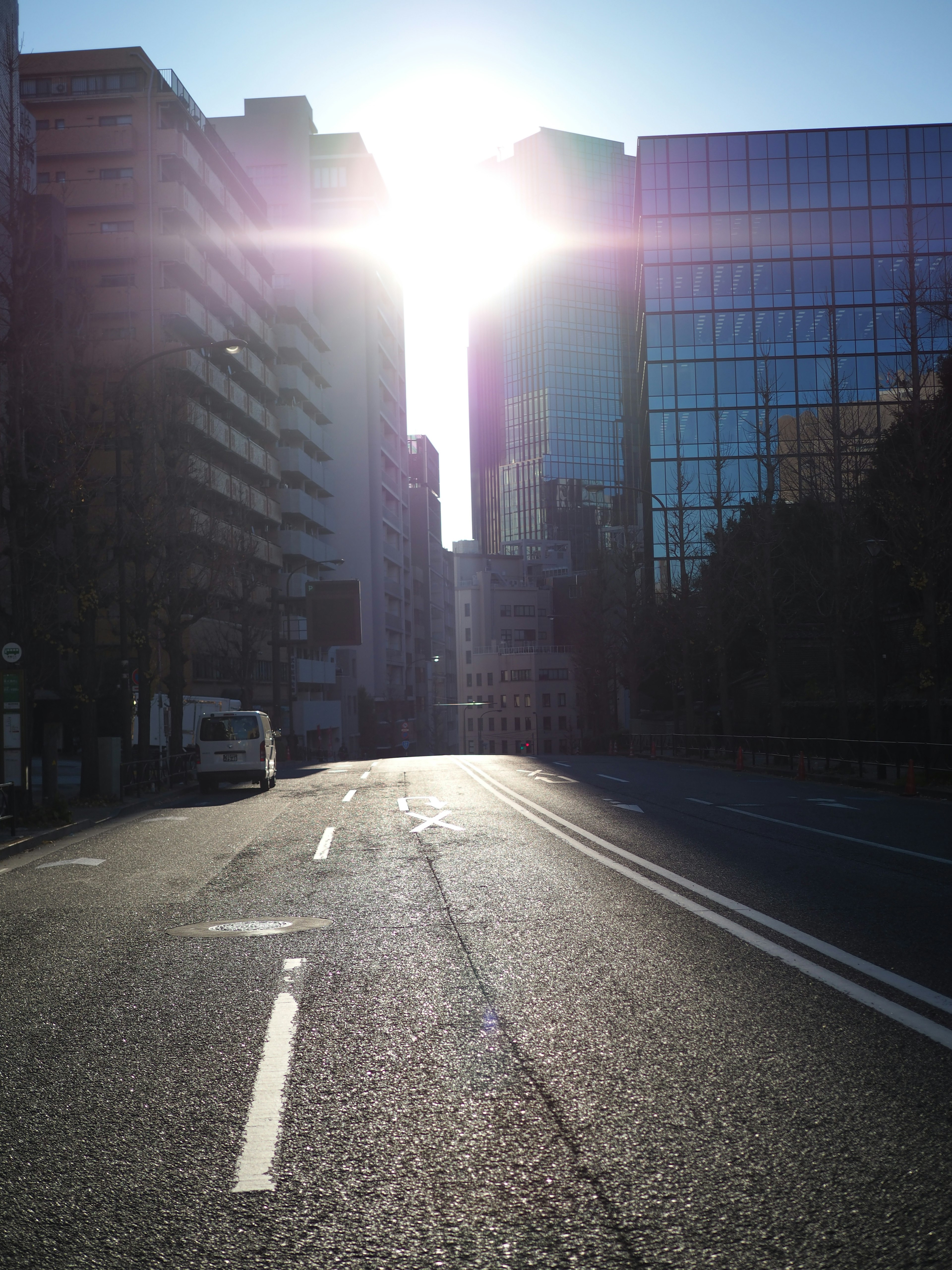 City street with sunlight shining between buildings