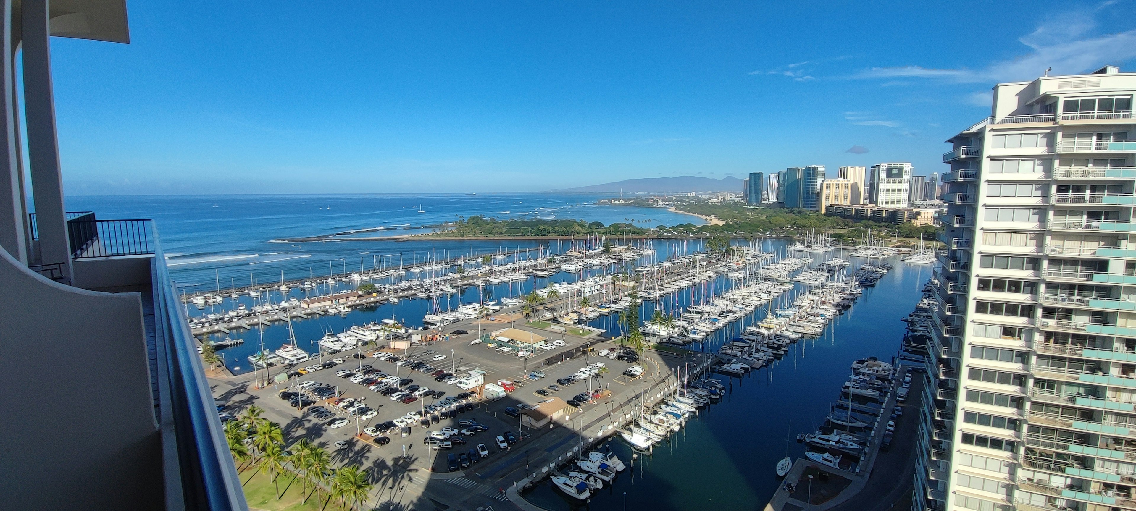 Panoramic view of the ocean and marina from a high-rise building