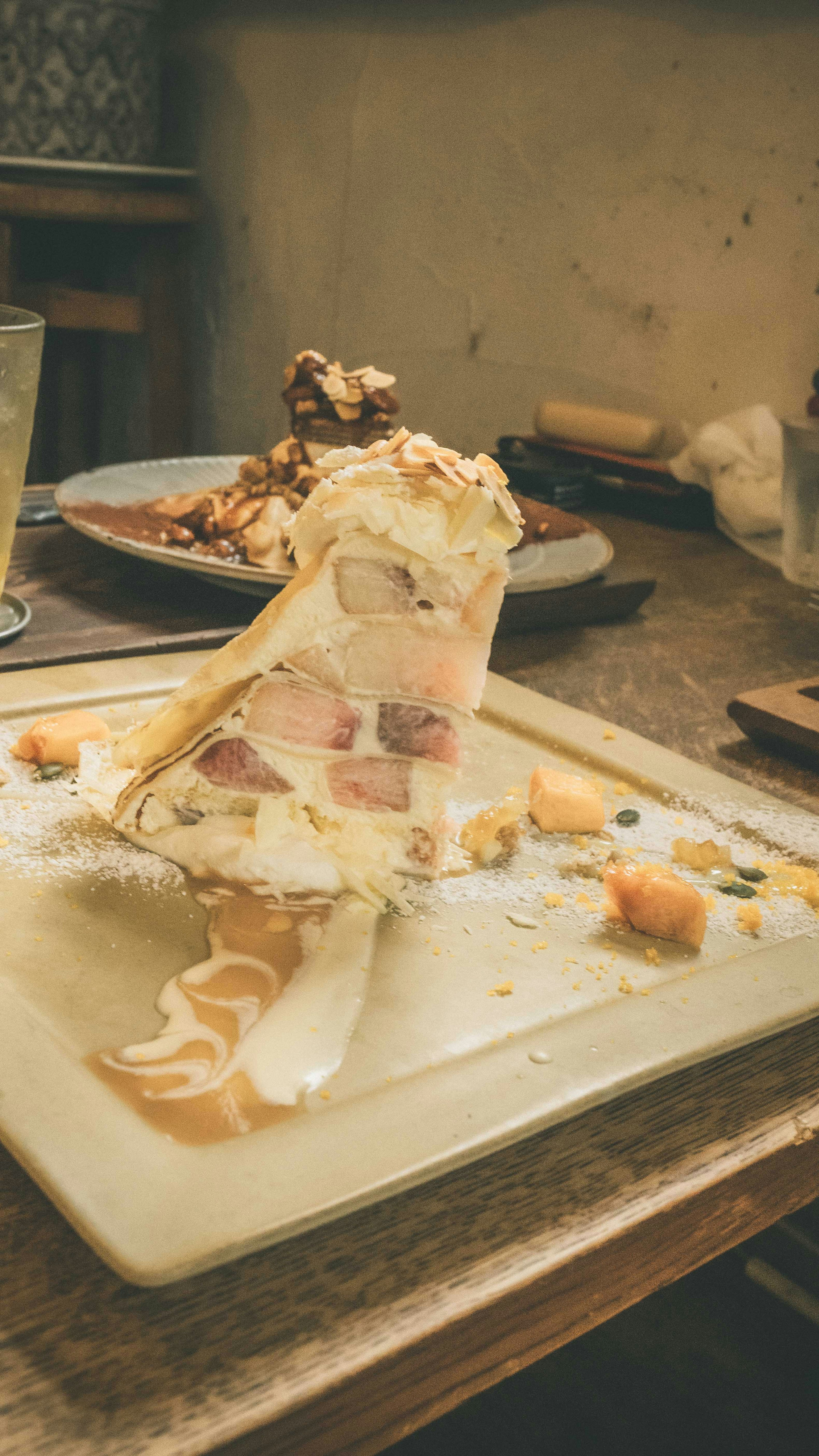 A delicious dessert on a plate with remnants of food around it