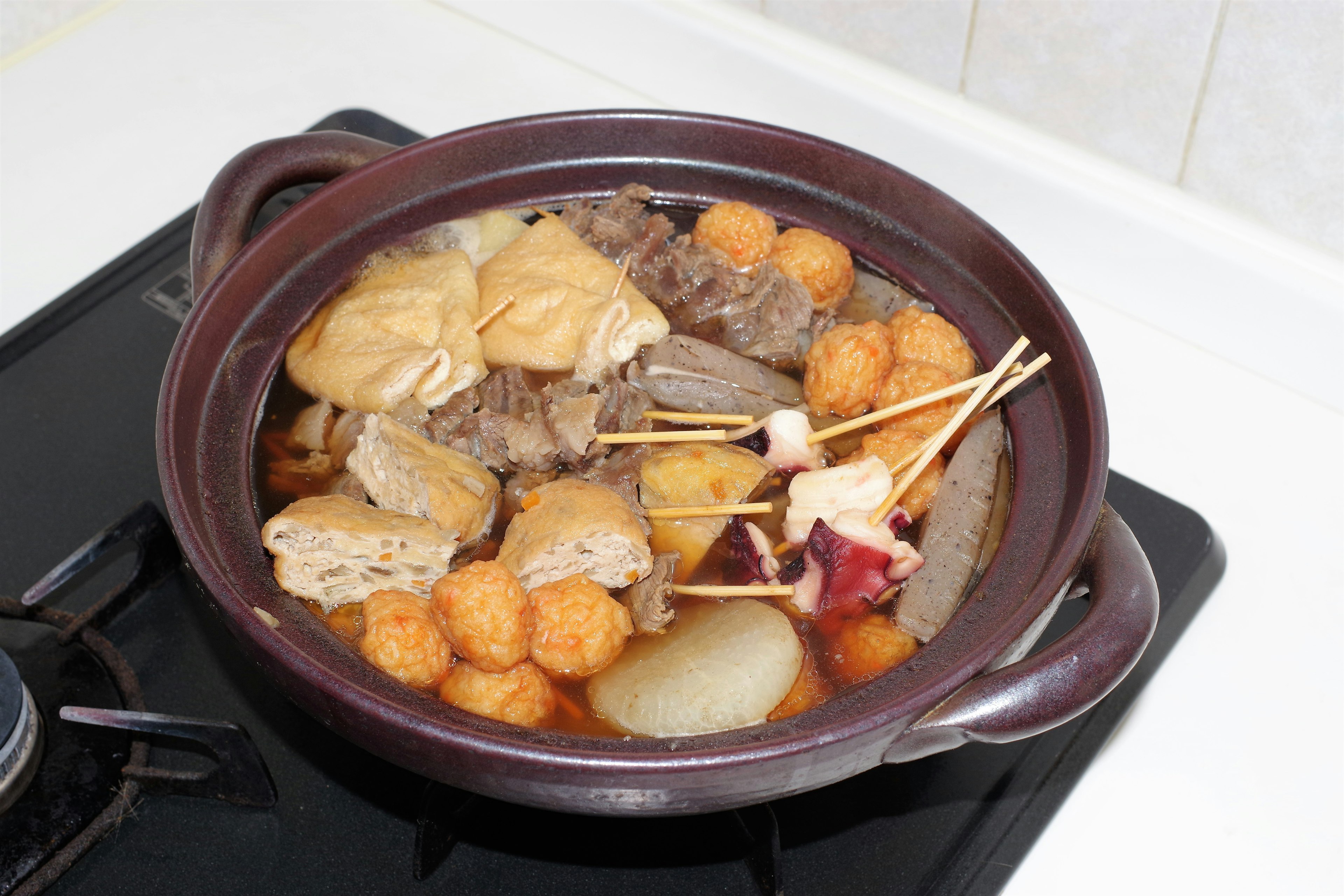 A warm dish with various ingredients in a pot