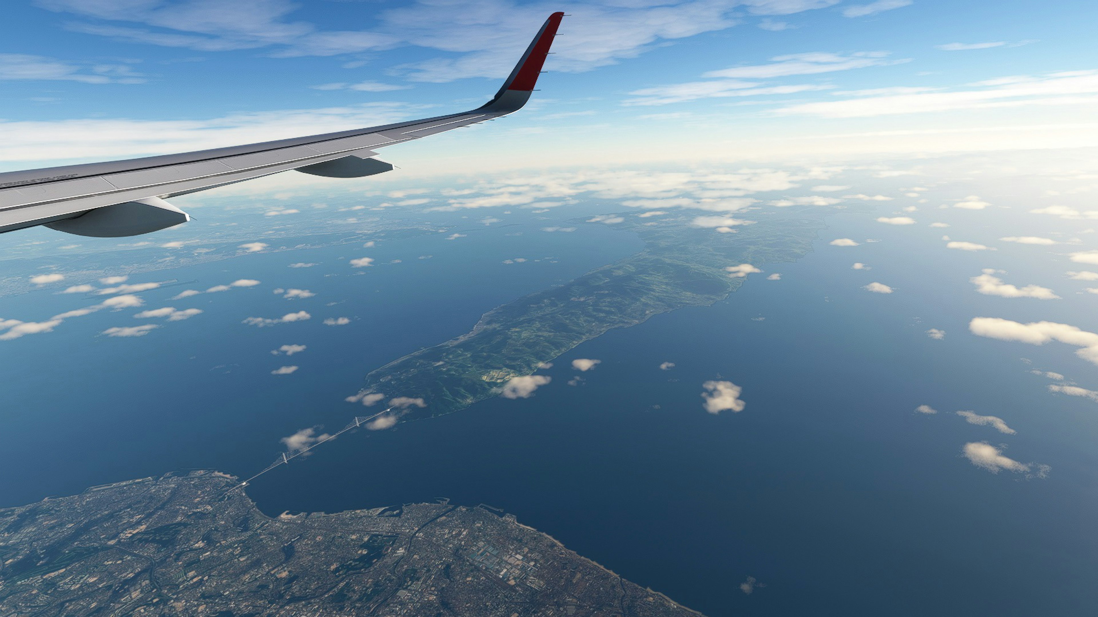 飛行機の翼と海の上の島の眺め