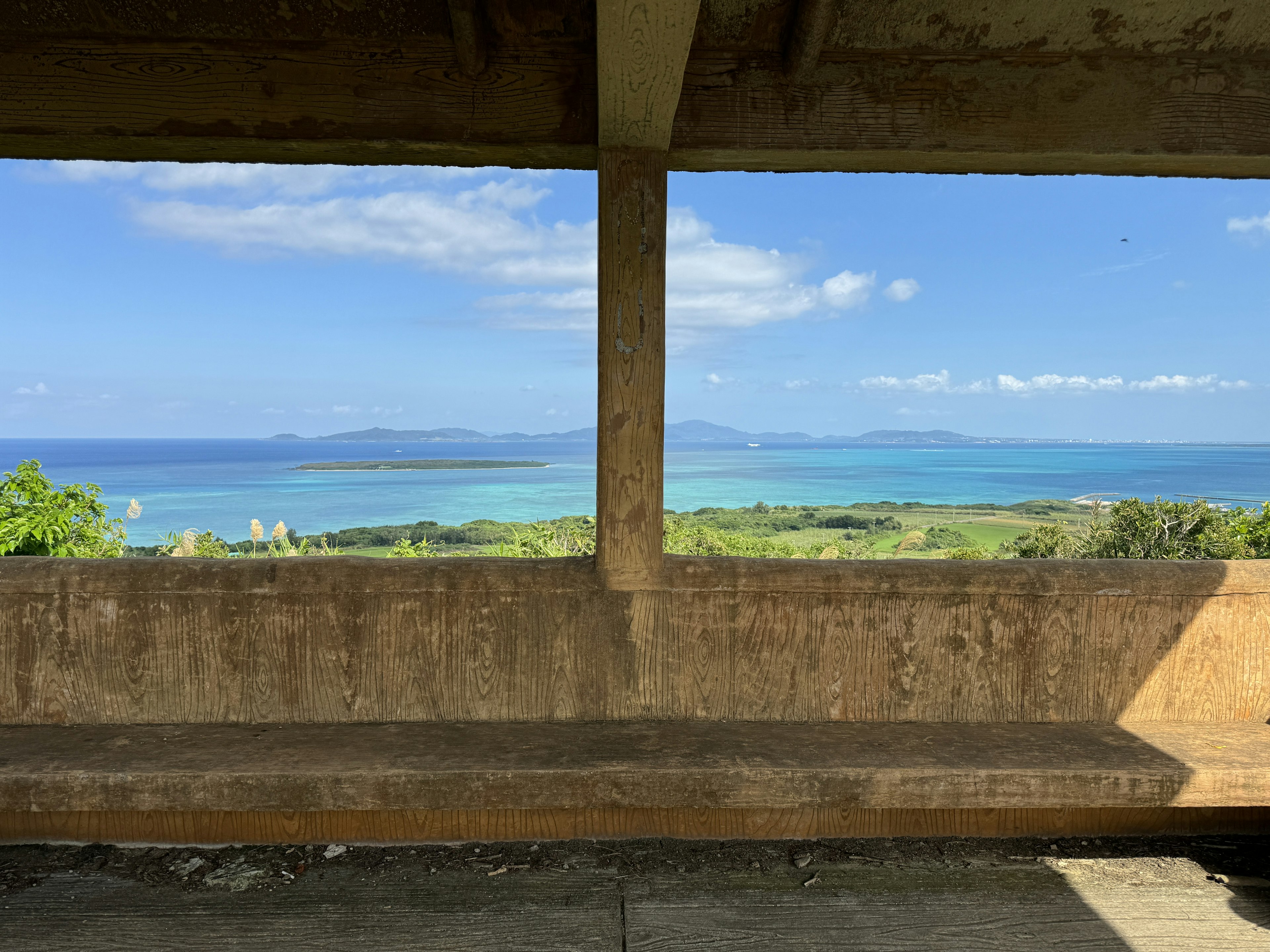 View of blue sea and islands from a concrete structure