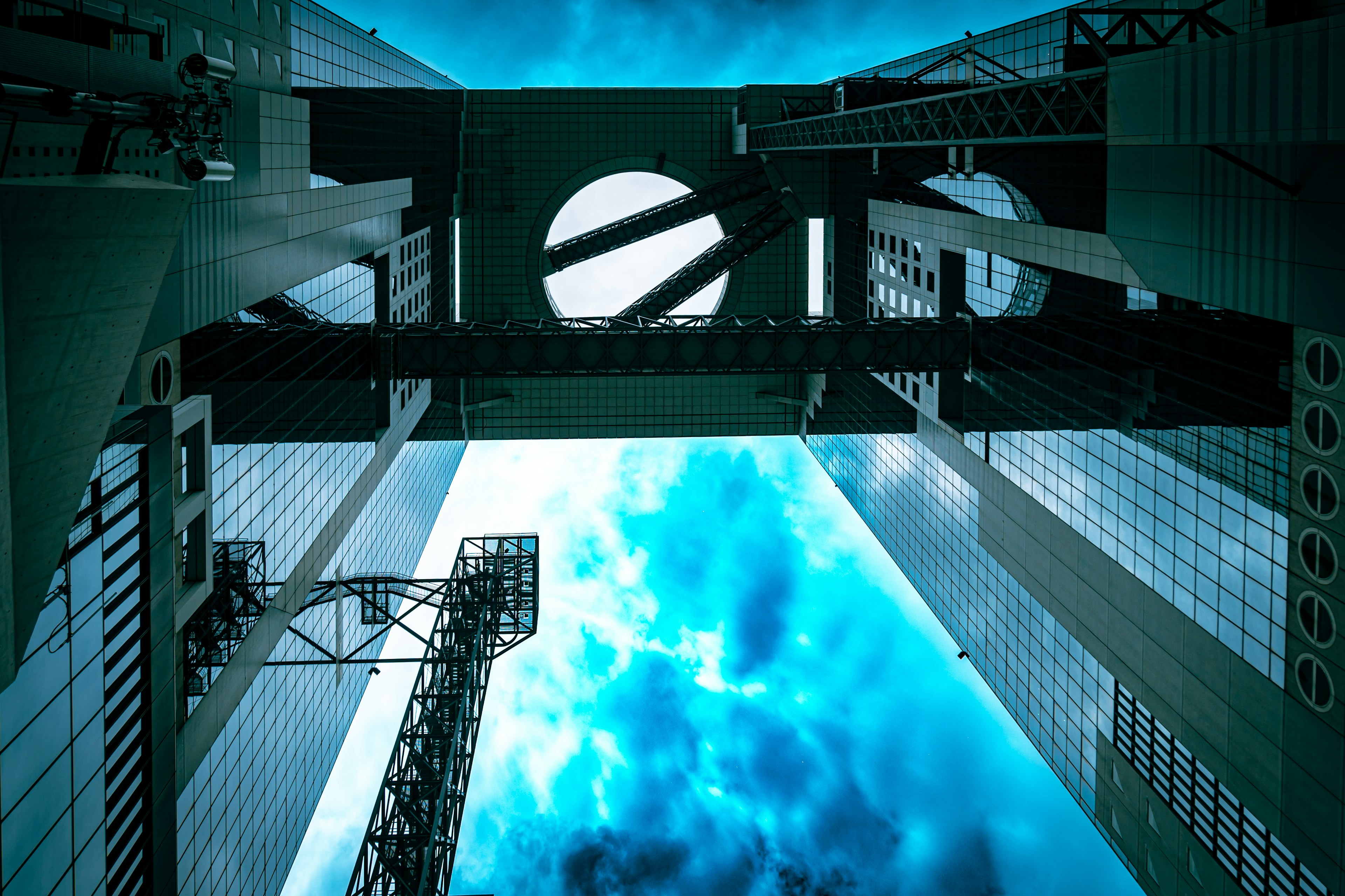 View of blue sky and clouds through high-rise buildings