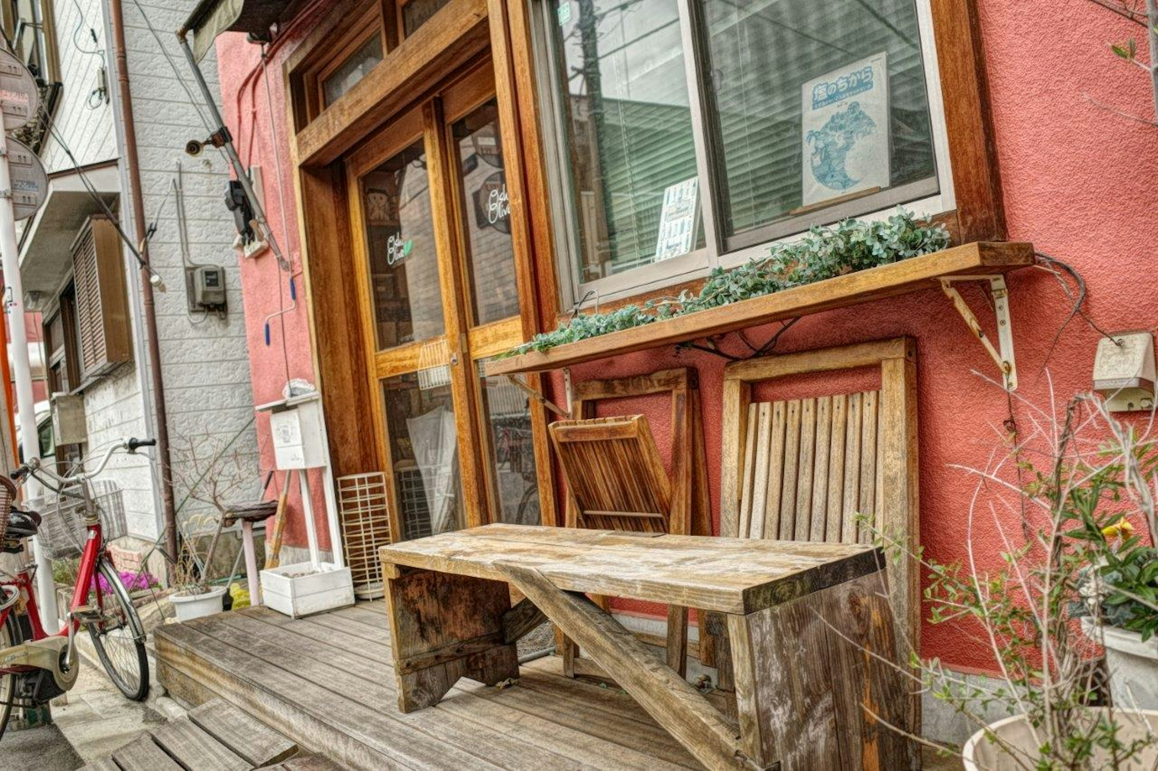 Cafe exterior with wooden table and colorful walls