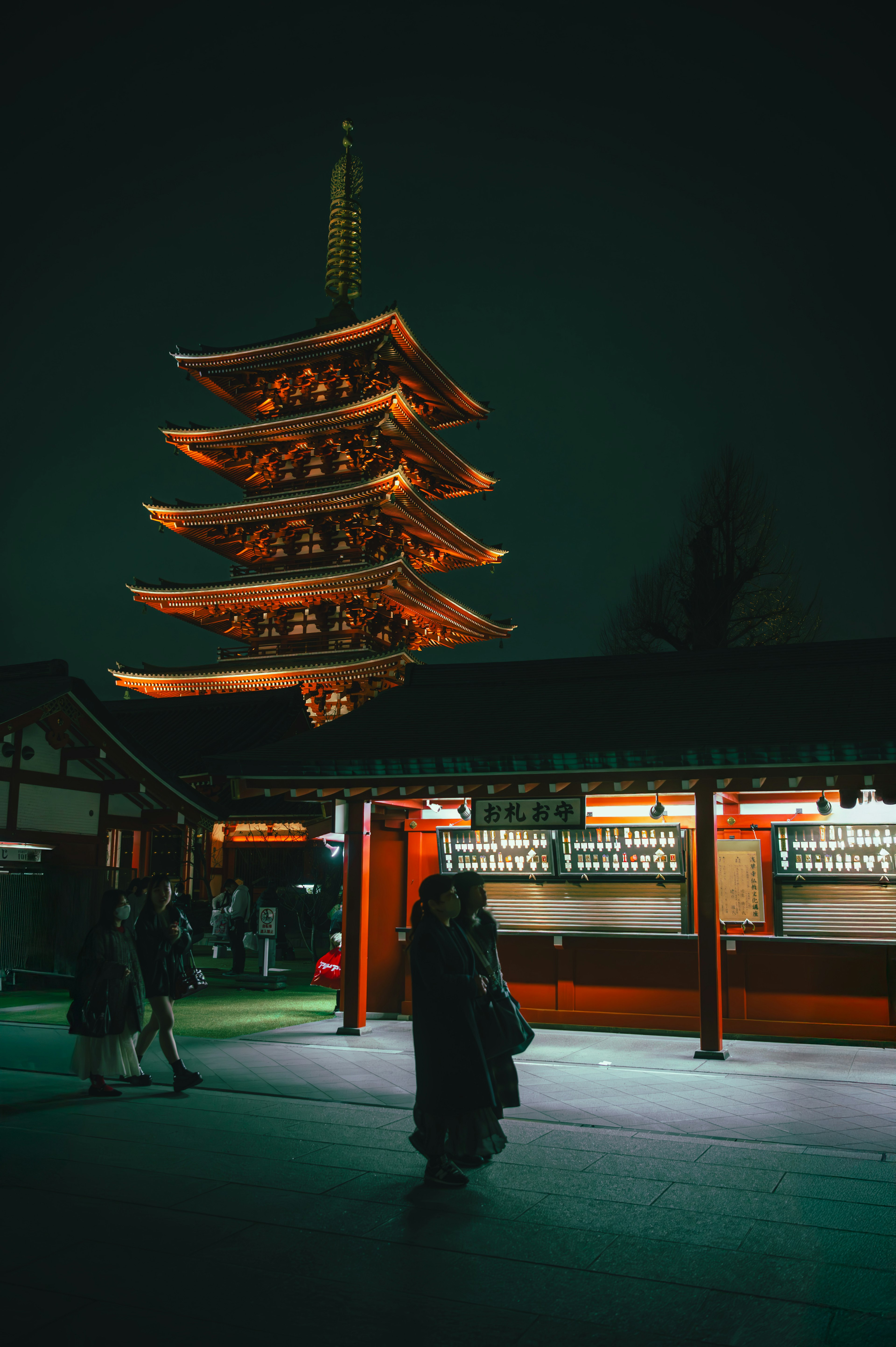 Night view of a five-story pagoda with visitors