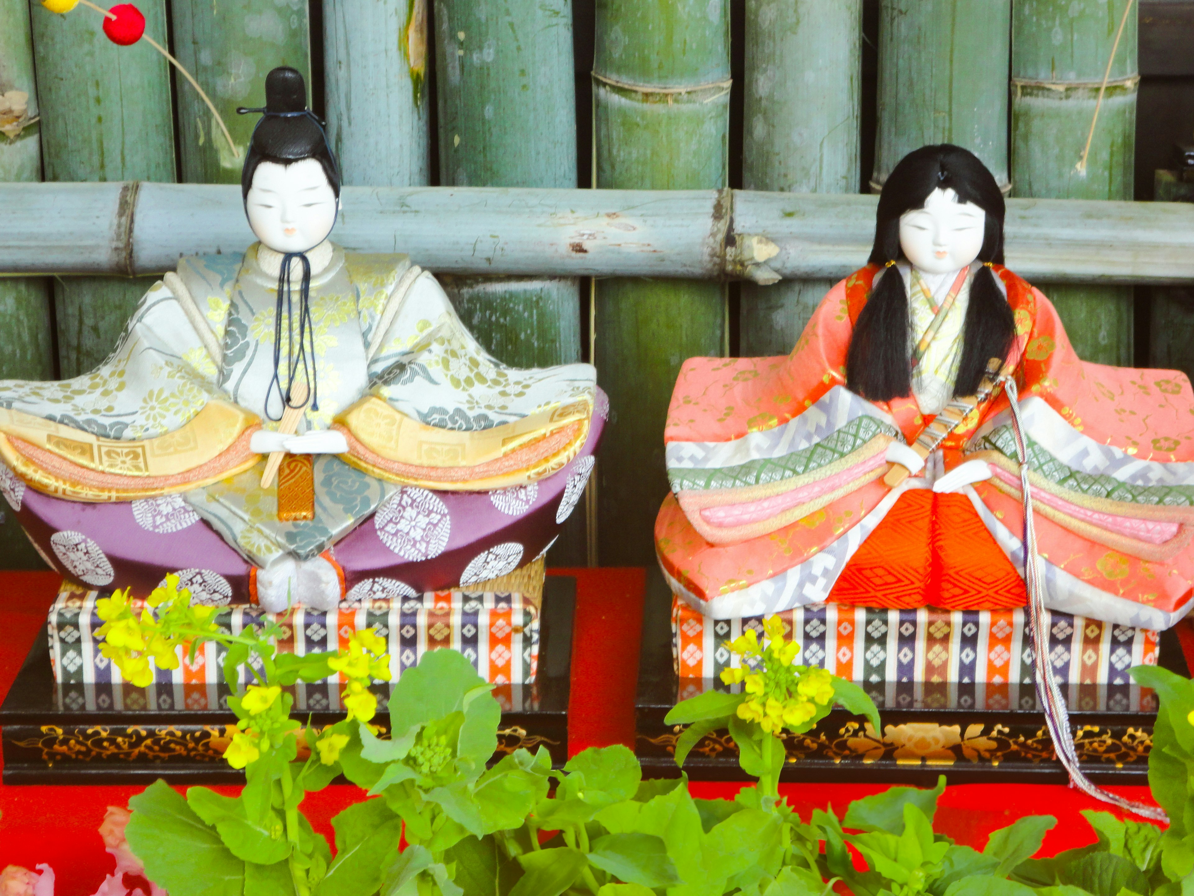 Hinamatsuri dolls displayed against a bamboo background