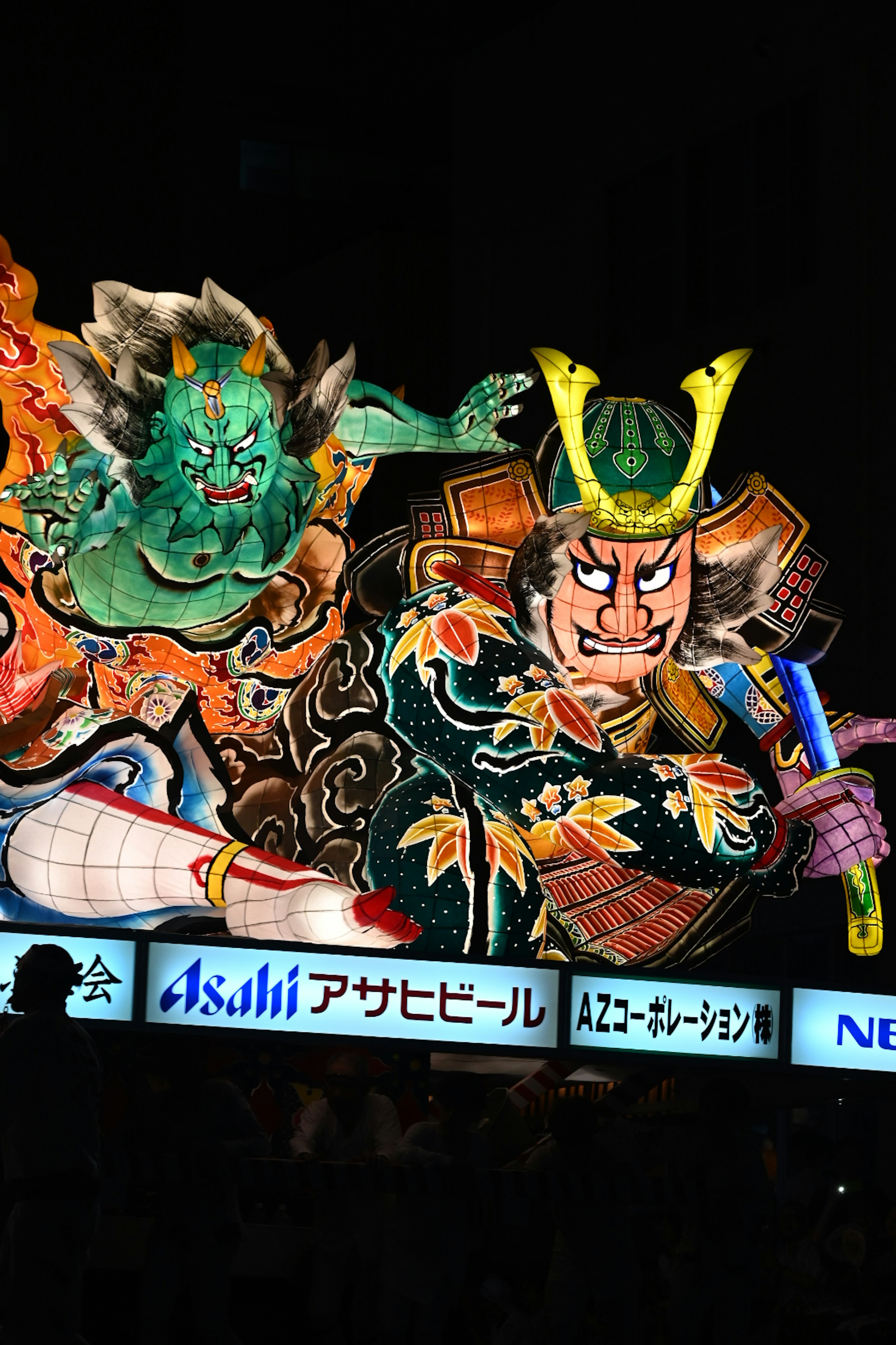 Traditional Japanese ukiyo-e style decoration featuring a blue demon and a samurai