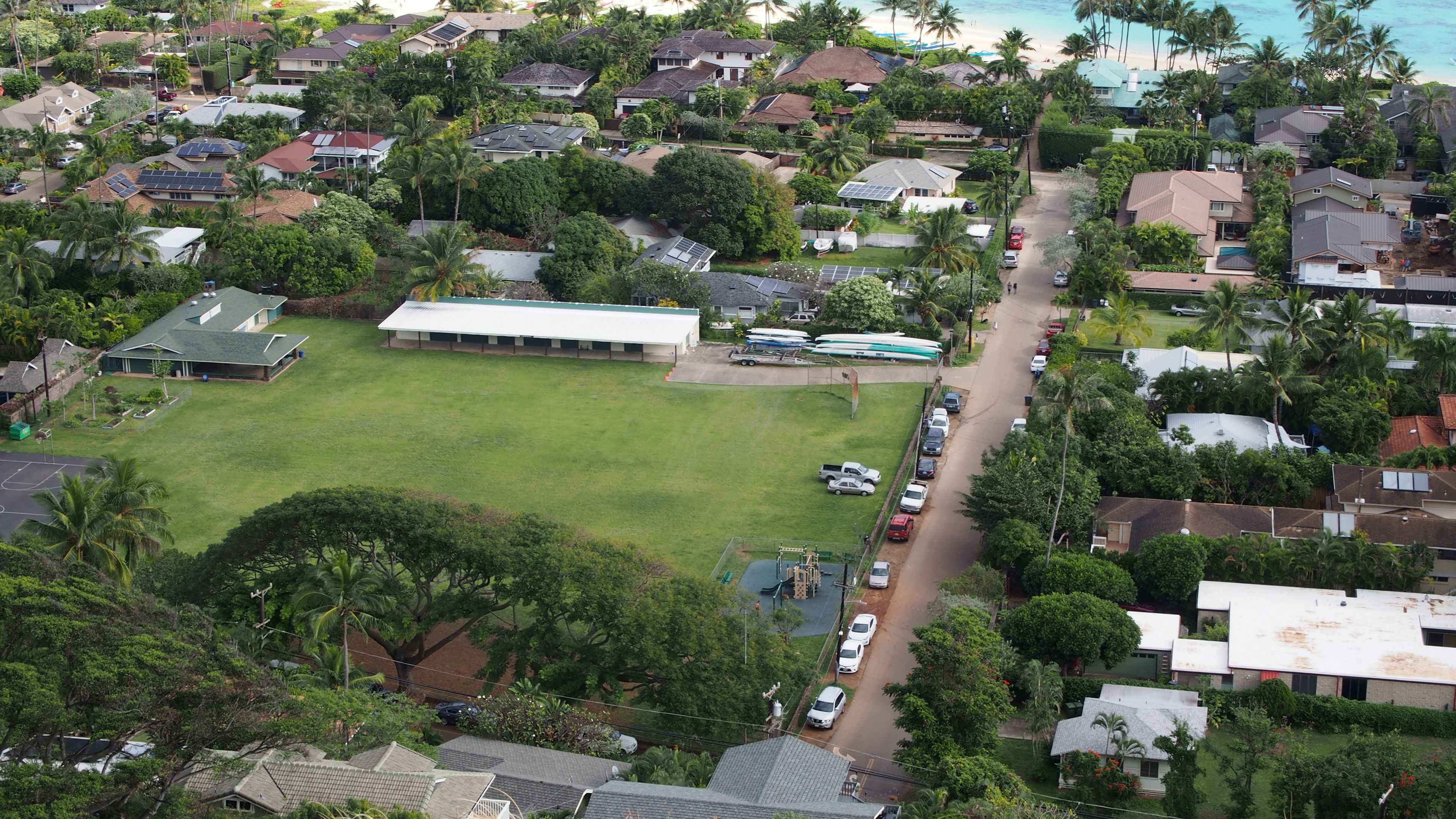 Aerial view of a residential area with a large green space