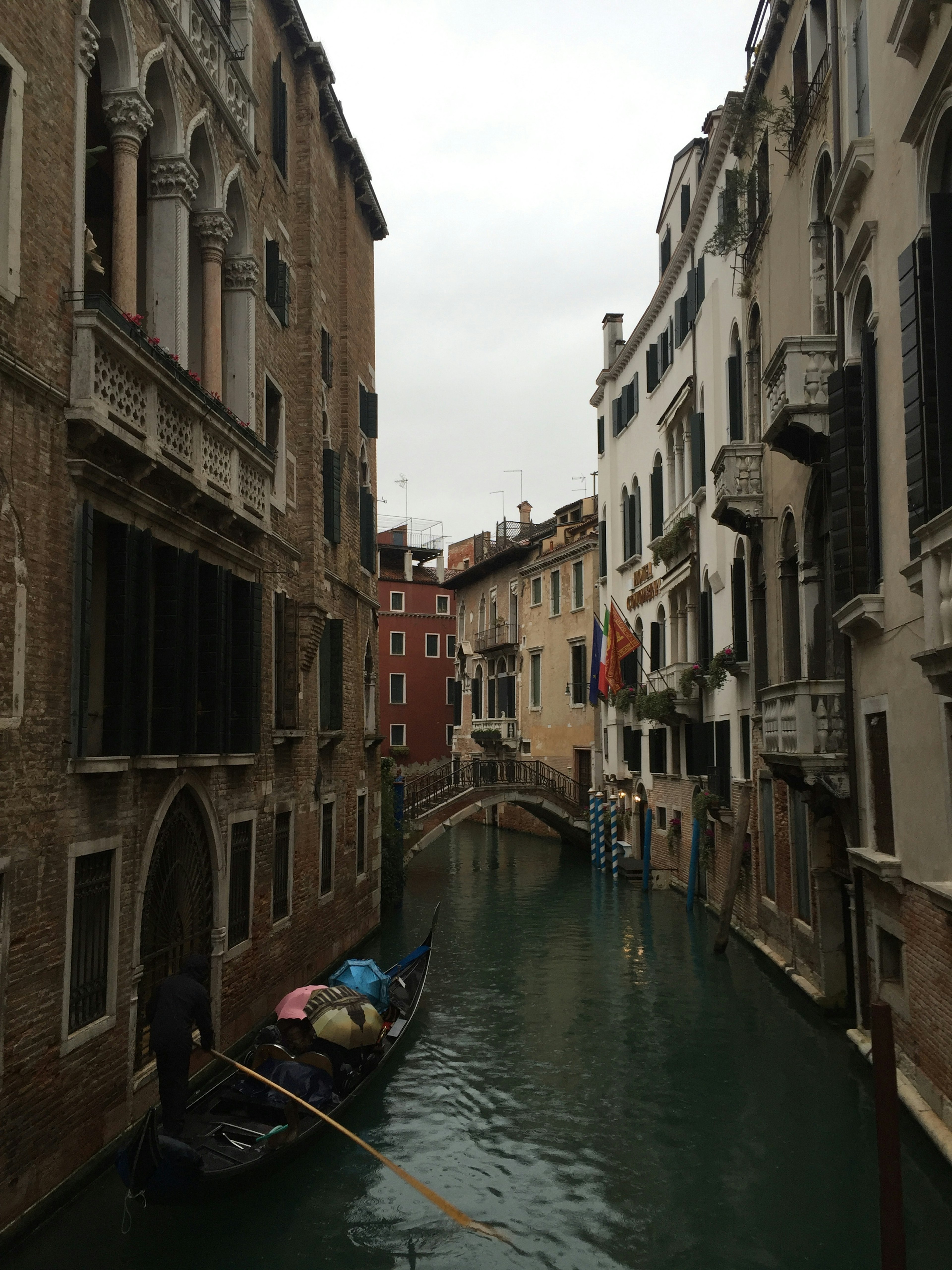 Gondola on a canal in Venice with historical buildings