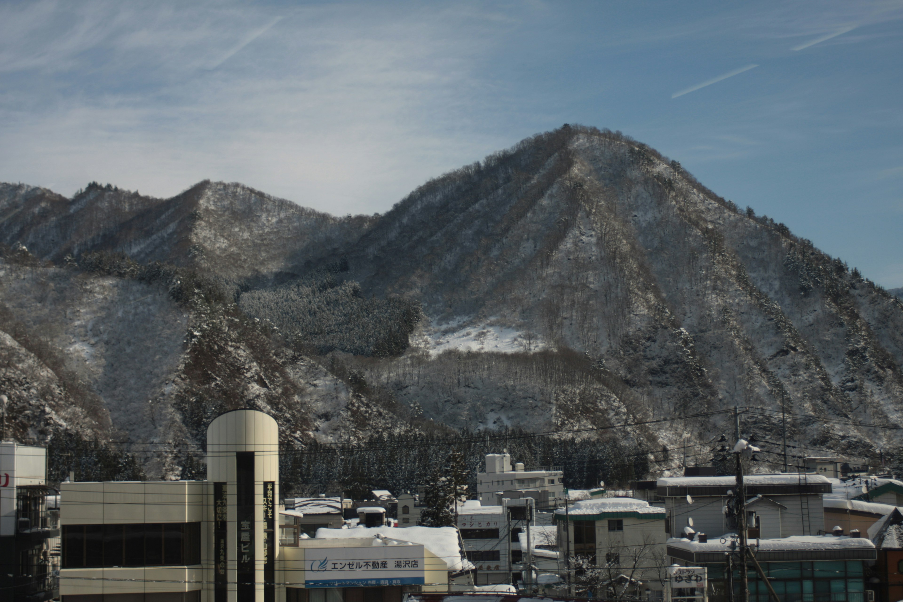 Snow-covered mountain with urban landscape