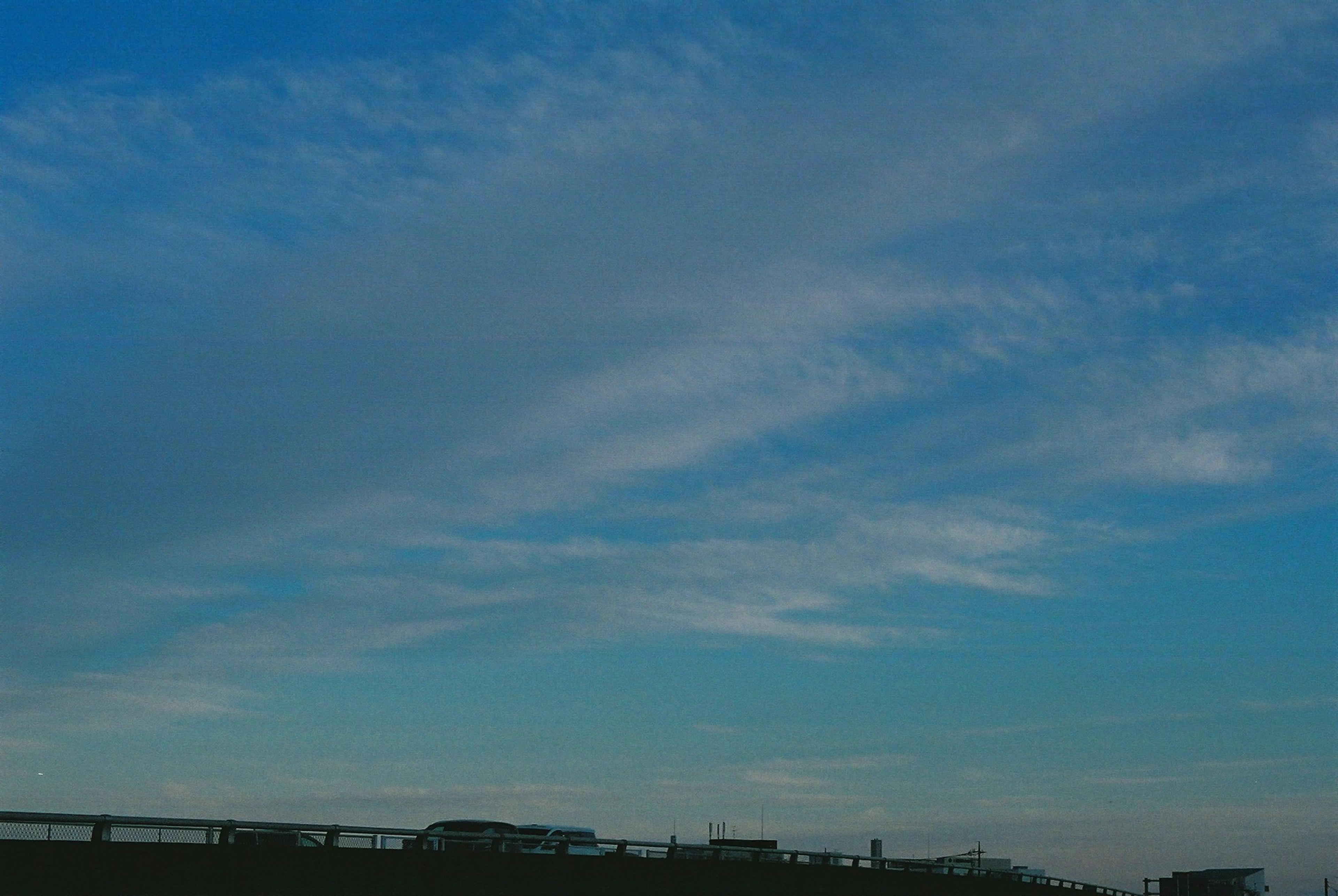 Expansive sky with soft clouds in blue hues