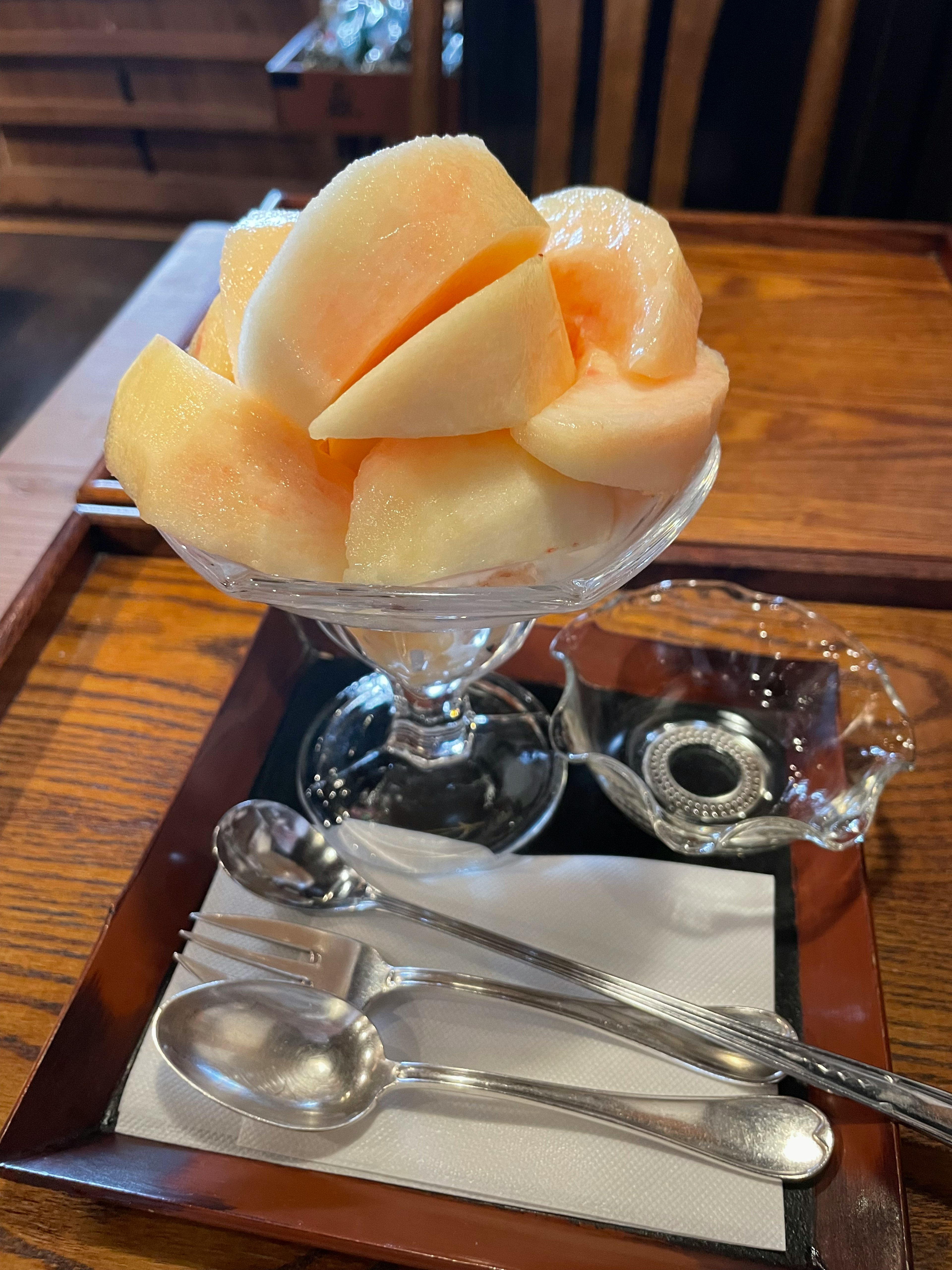 A beautifully arranged melon dessert in a clear glass bowl