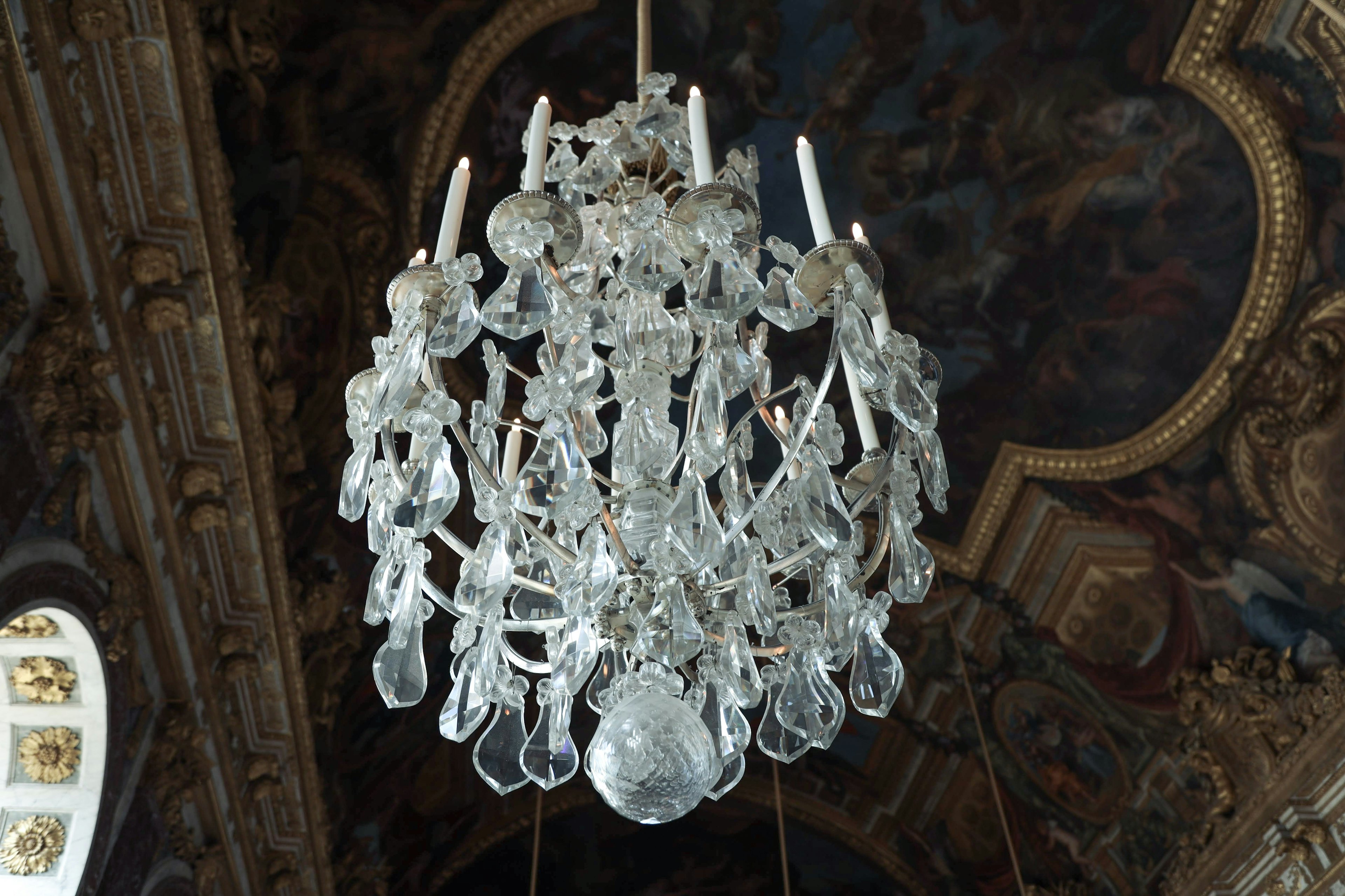 A beautiful room featuring an elegant chandelier hanging from the ceiling