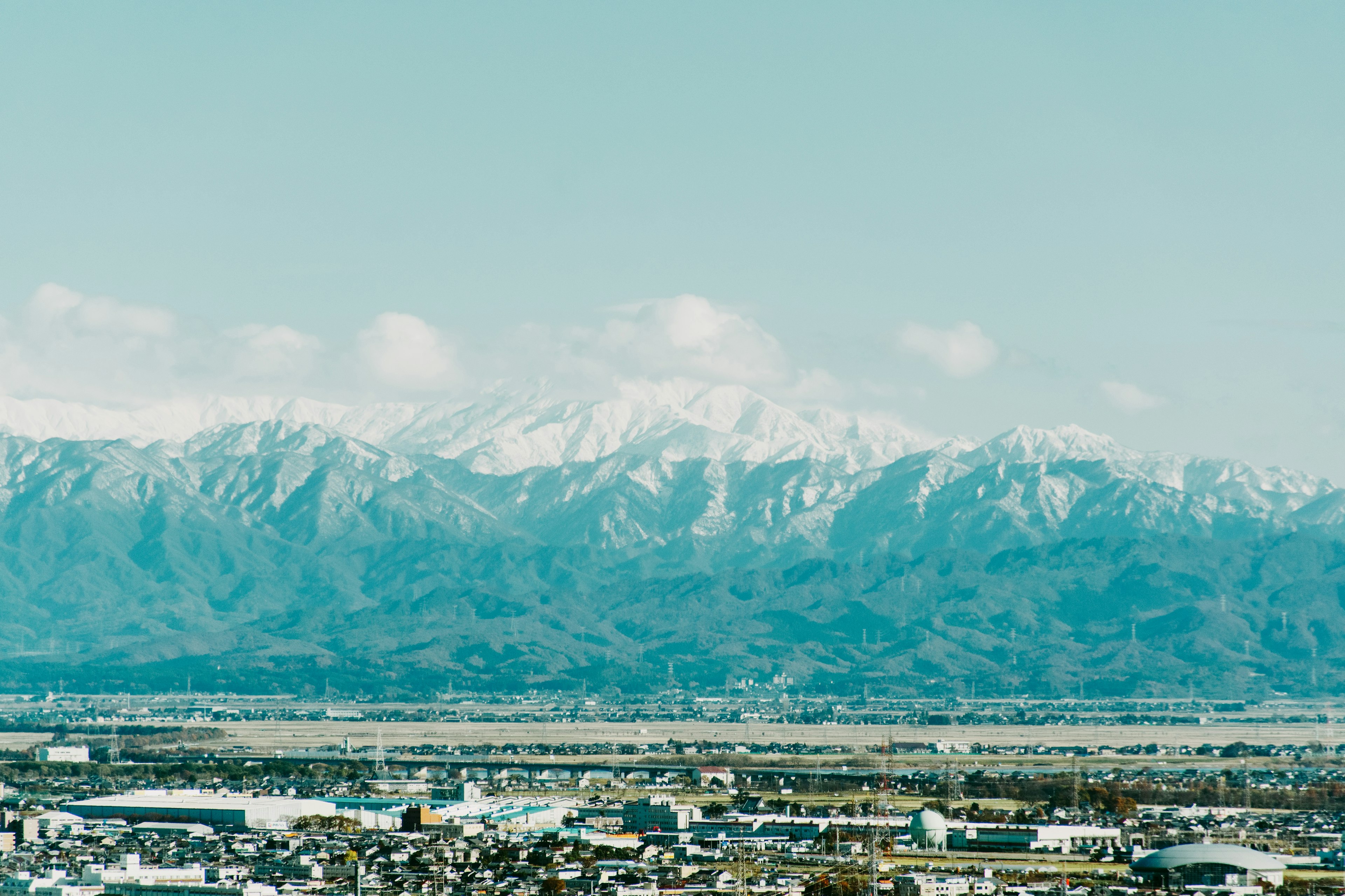 Snow-capped mountains under a clear blue sky