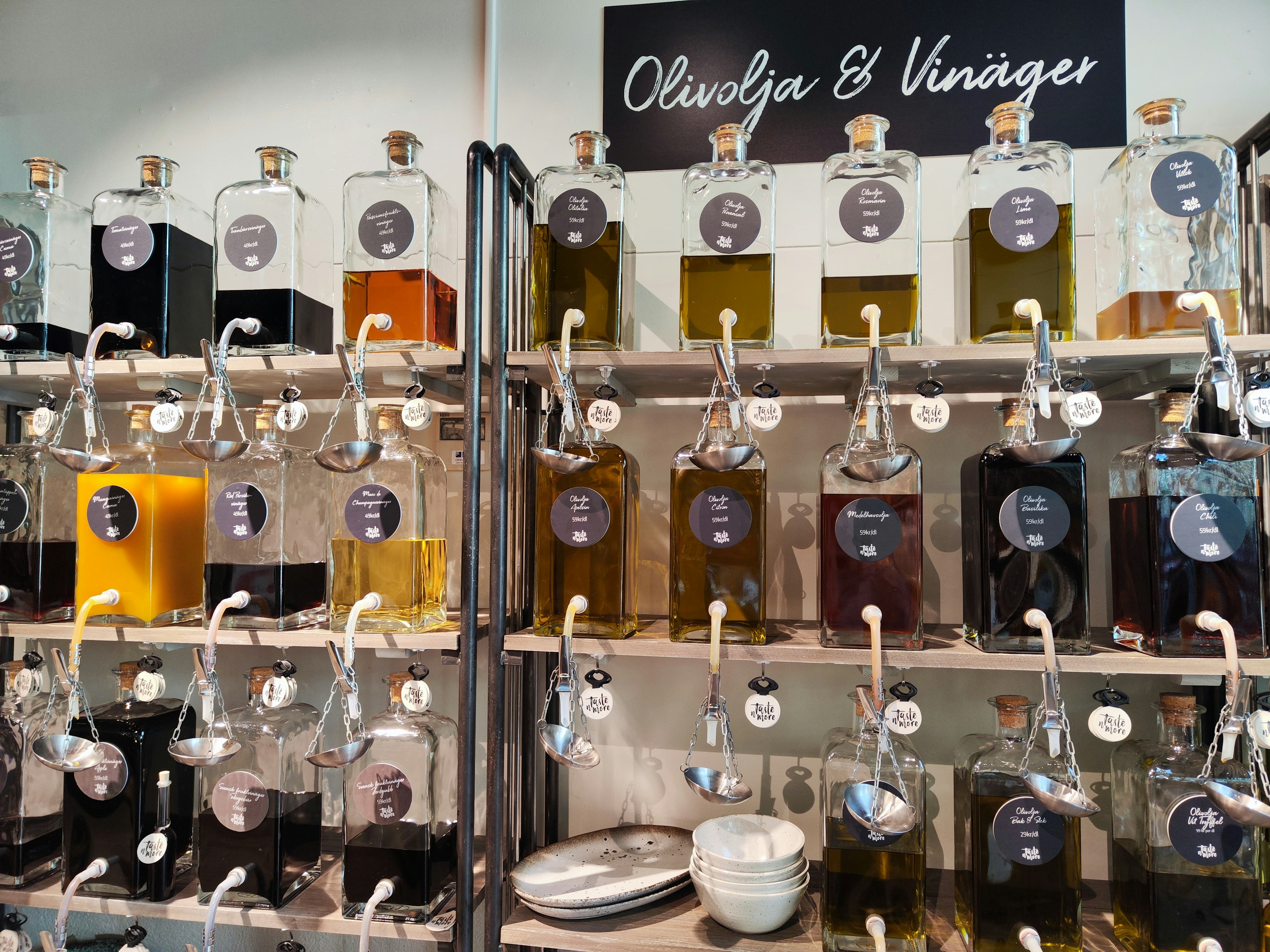 Display of various olive oils and vinegars in glass bottles