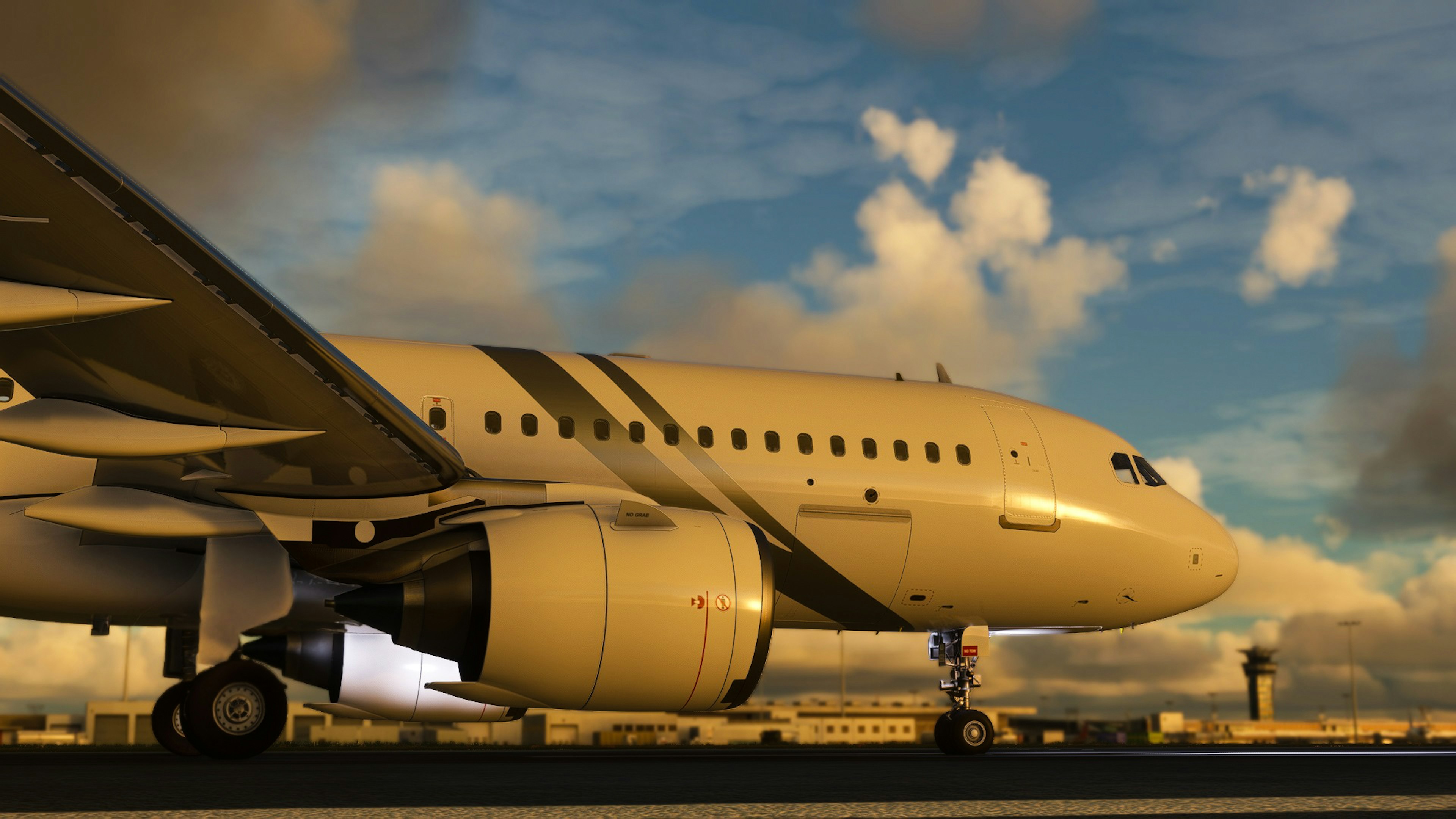 Airplane on the runway under a sunset sky