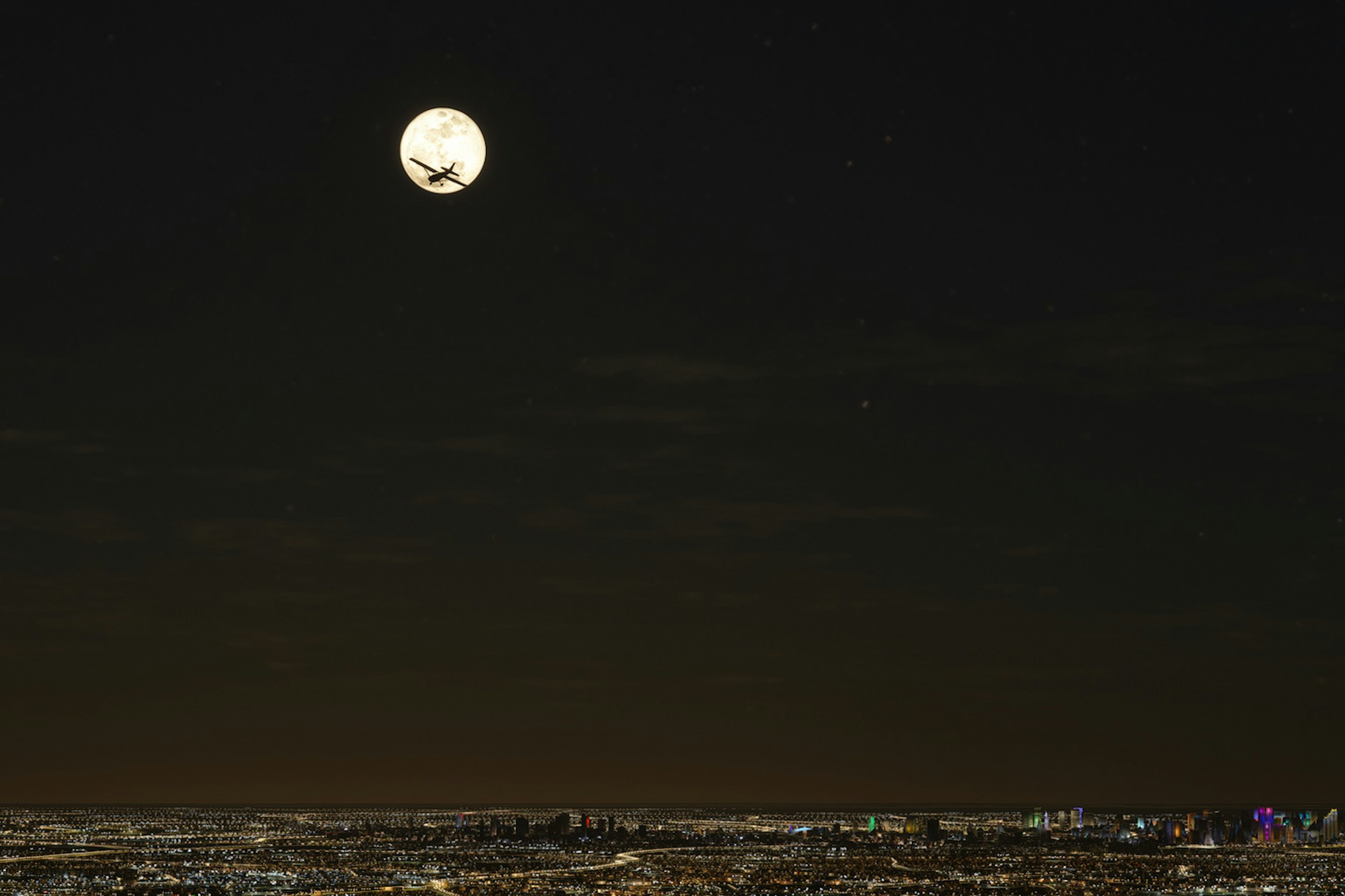 夜空中浮动的大月亮和黑暗的地平线