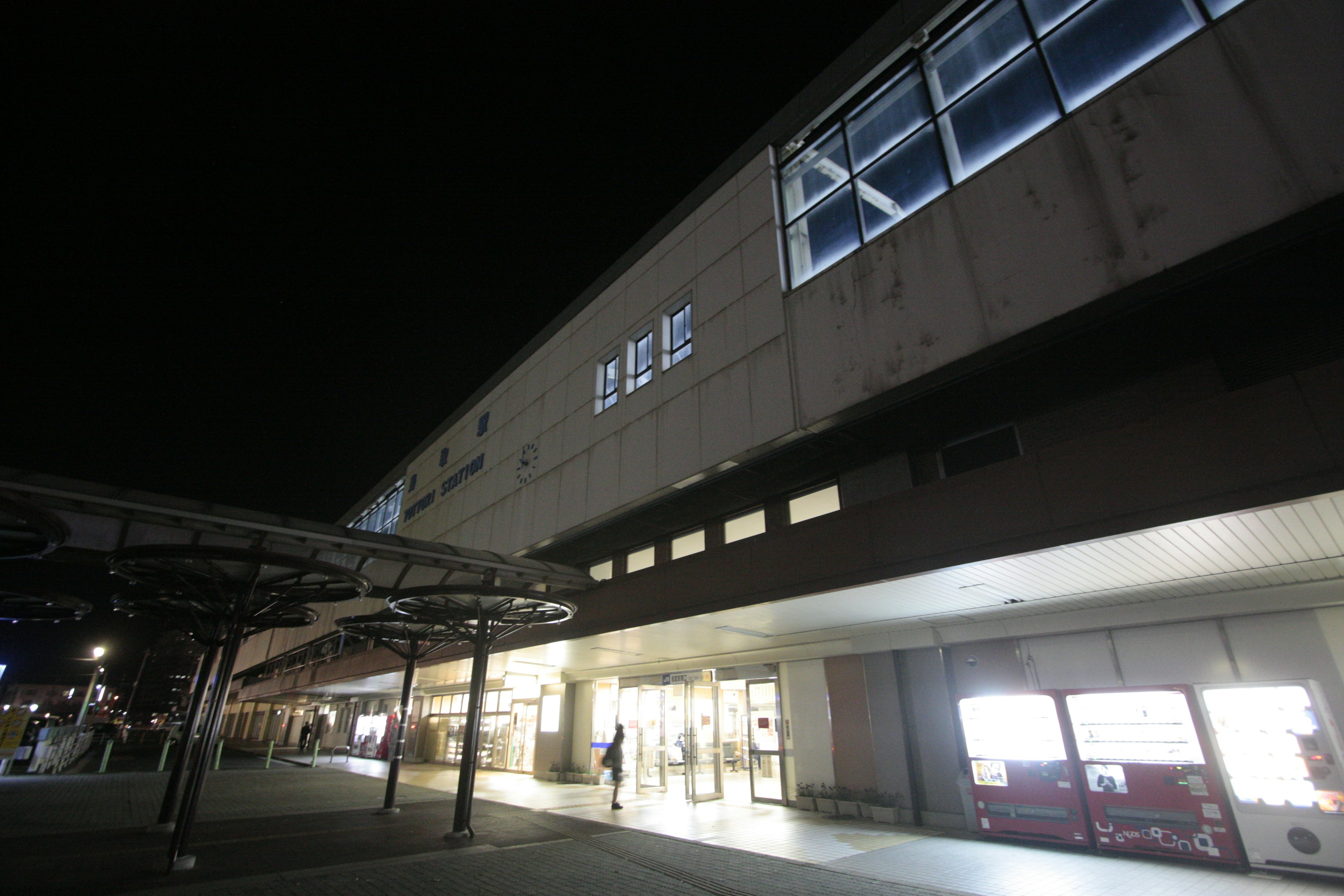 Exterior of a train station at night Bright lighting Modern architecture