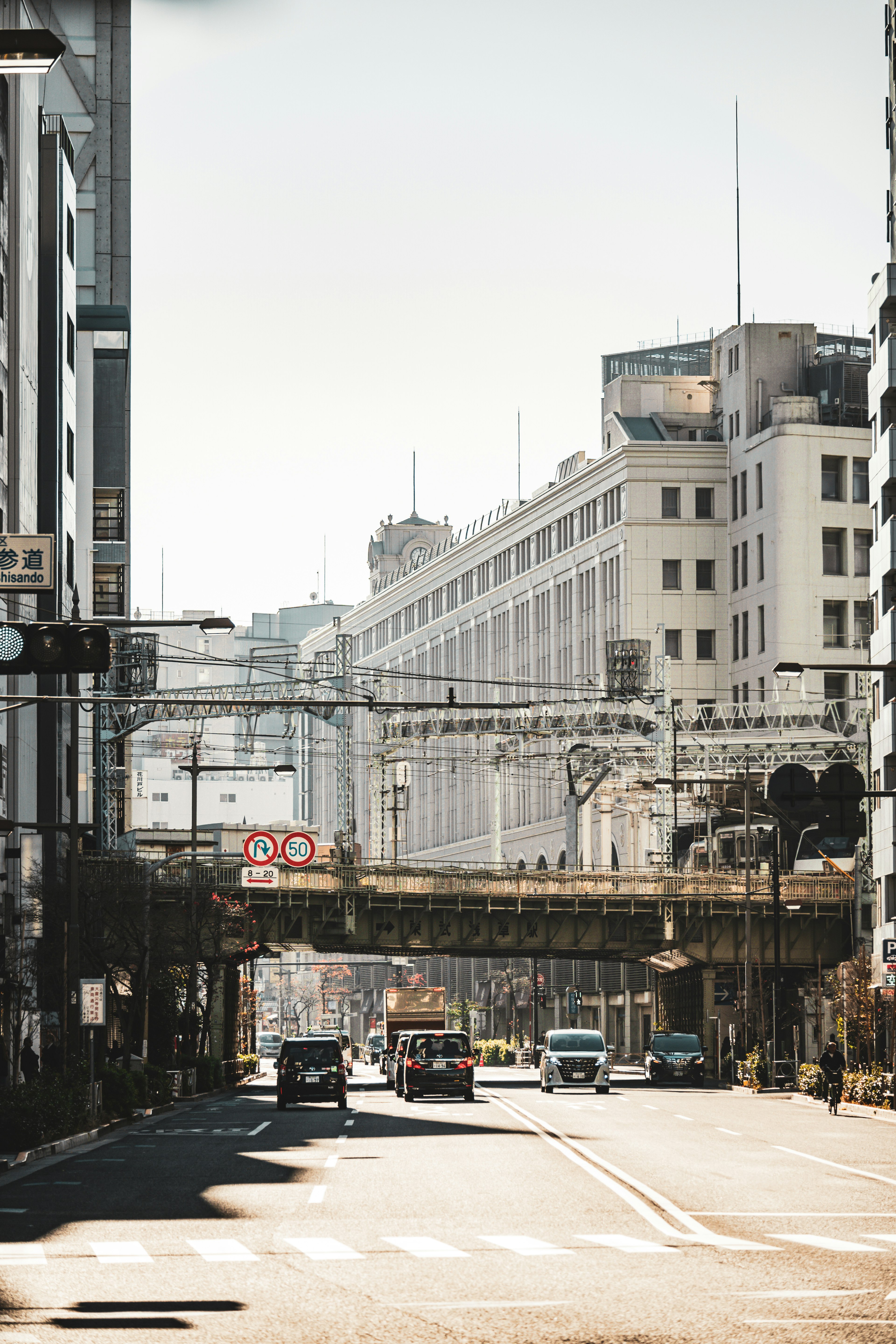 Urban street view featuring buildings and an overpass