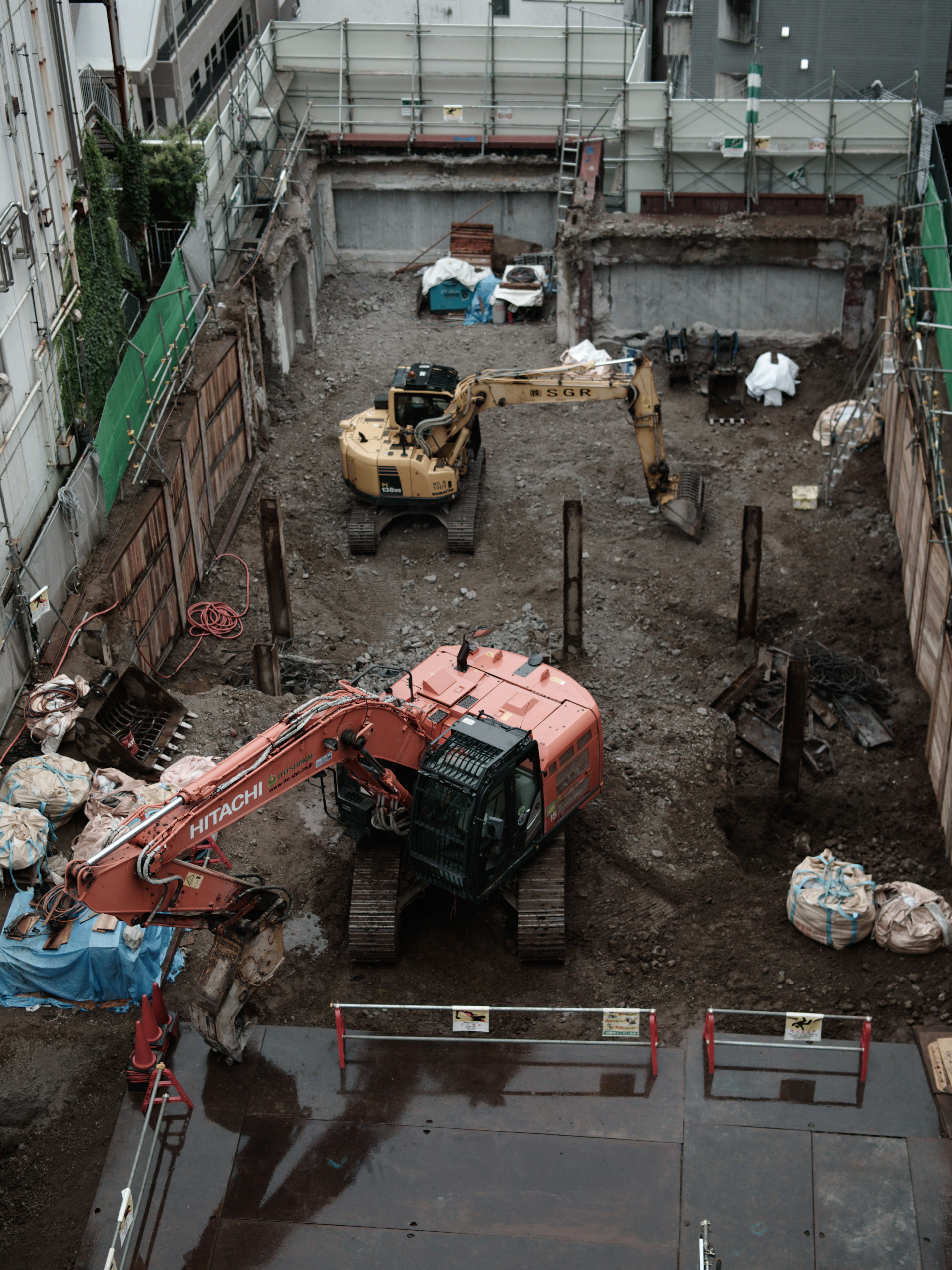 Construction site excavation area with machinery and materials