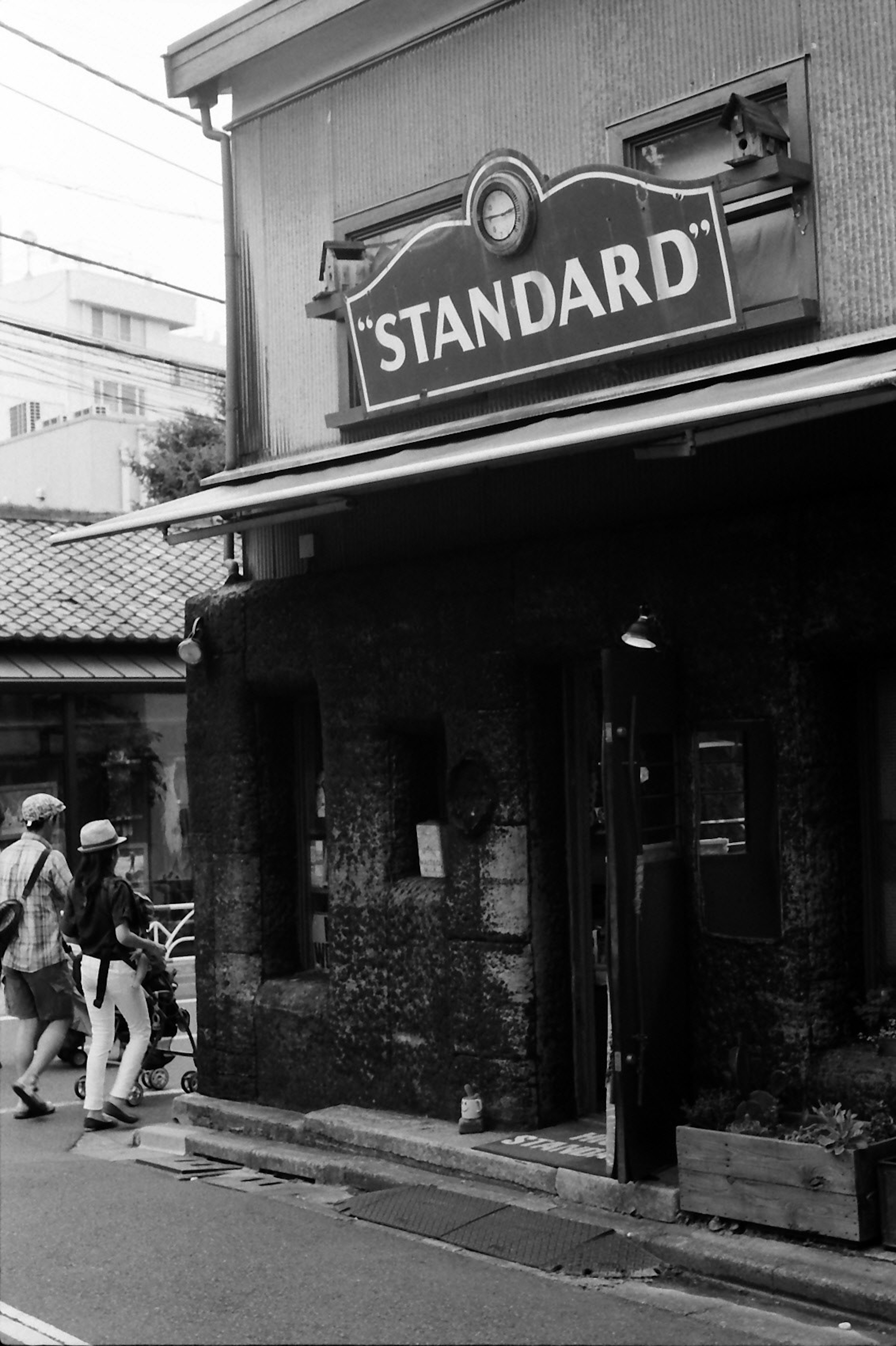 Storefront with STANDARD sign in black and white