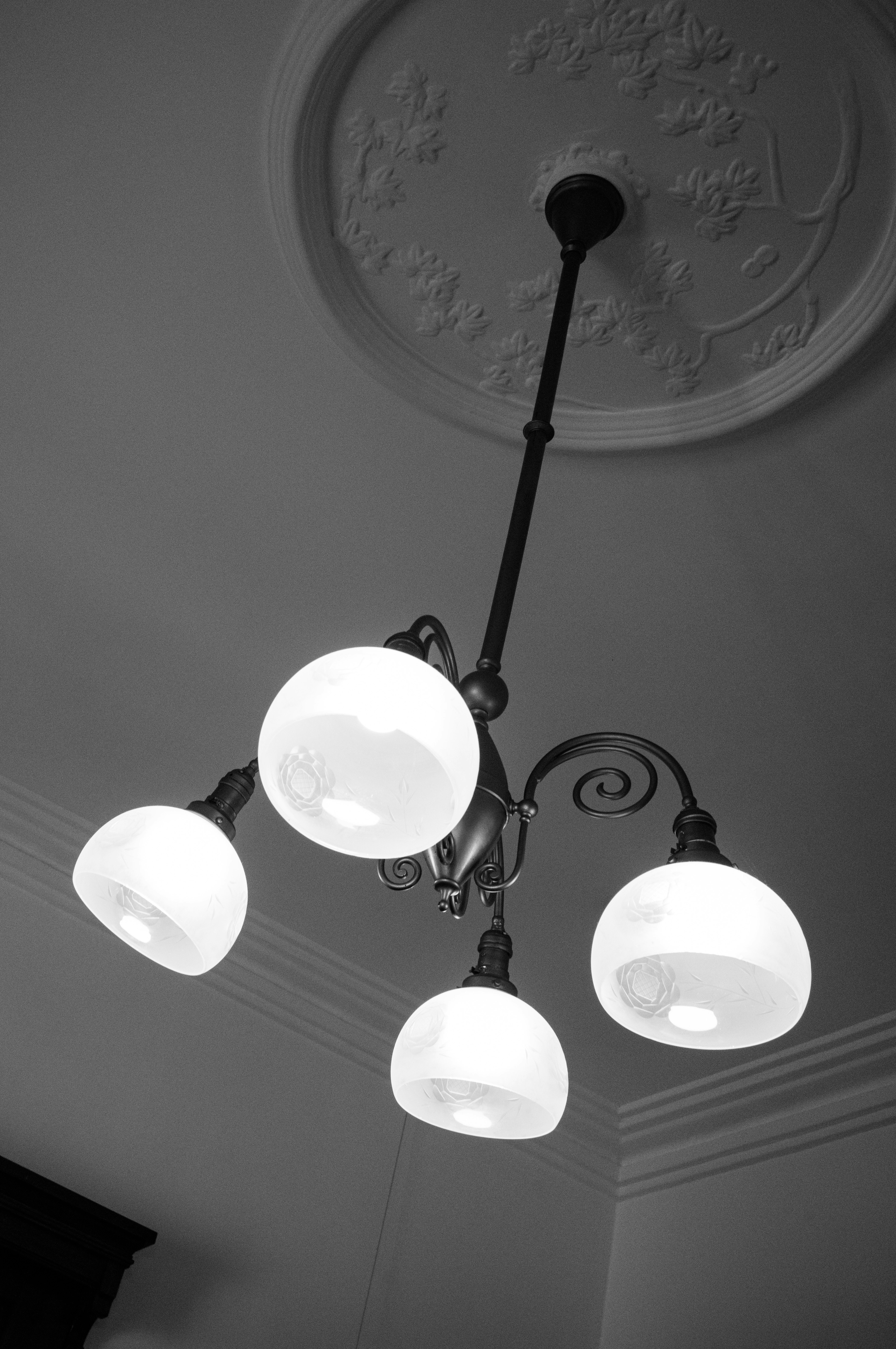 A black and white chandelier hanging from the ceiling