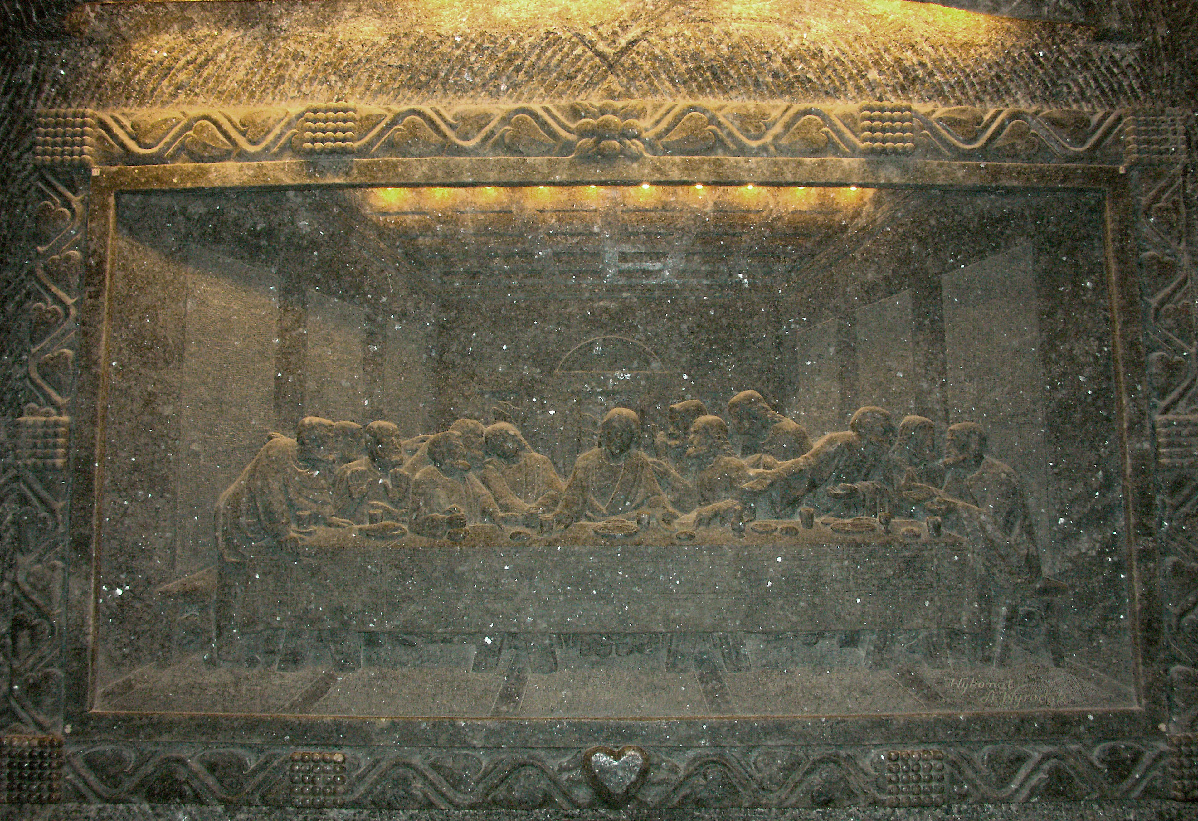 Carved relief depicting the Last Supper scene with intricate details